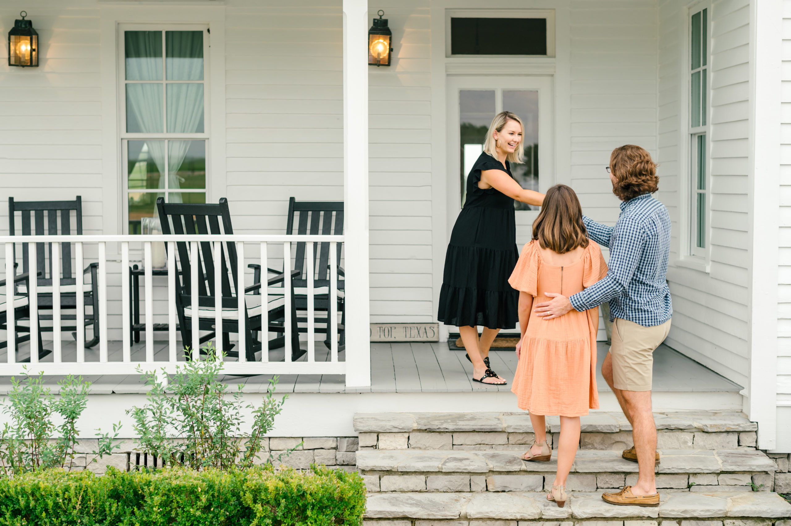 Friendly vacation rental manager greeting guests upon arrival in round top texas