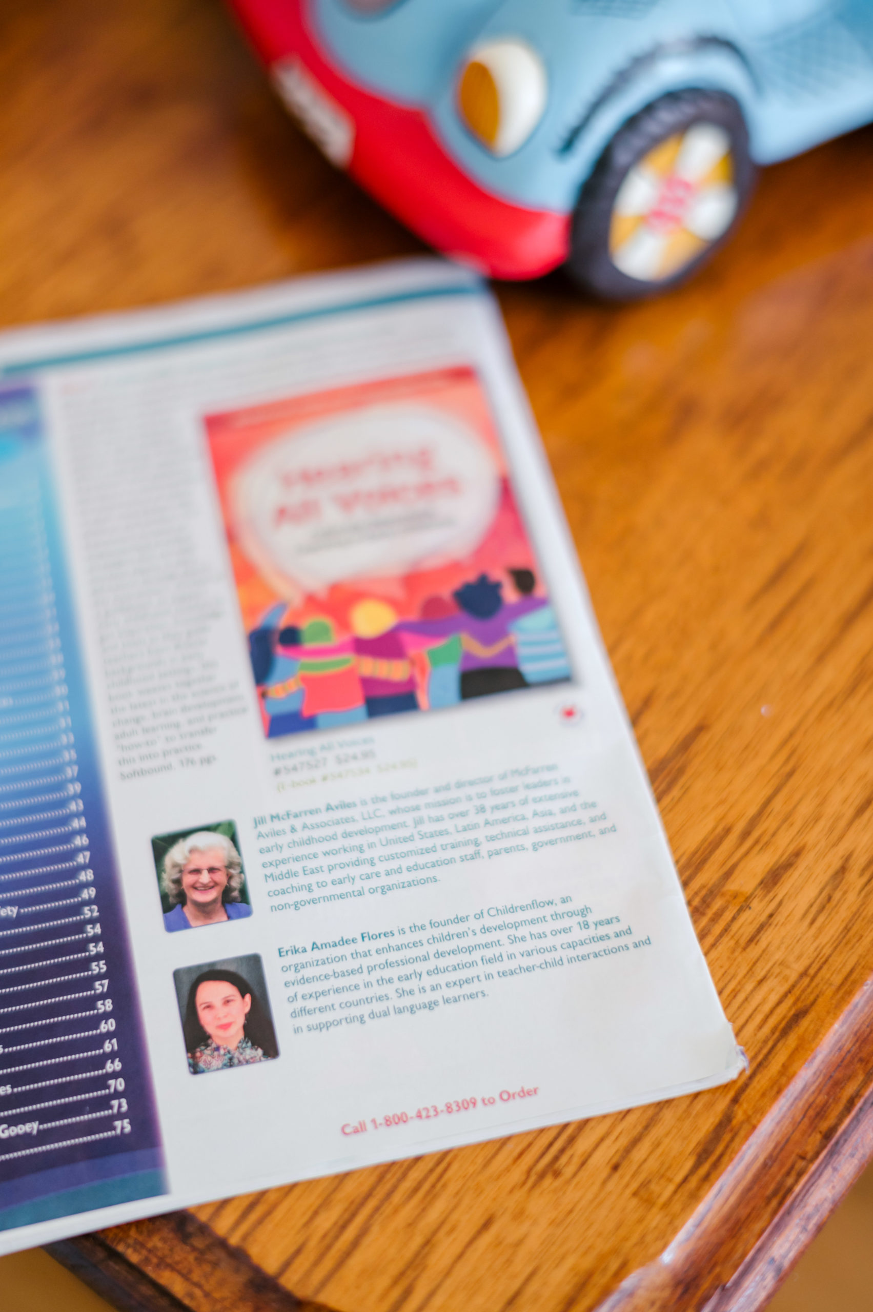 Photo of a picture of the front cover of the book Hearing All Voices during her branding photography session