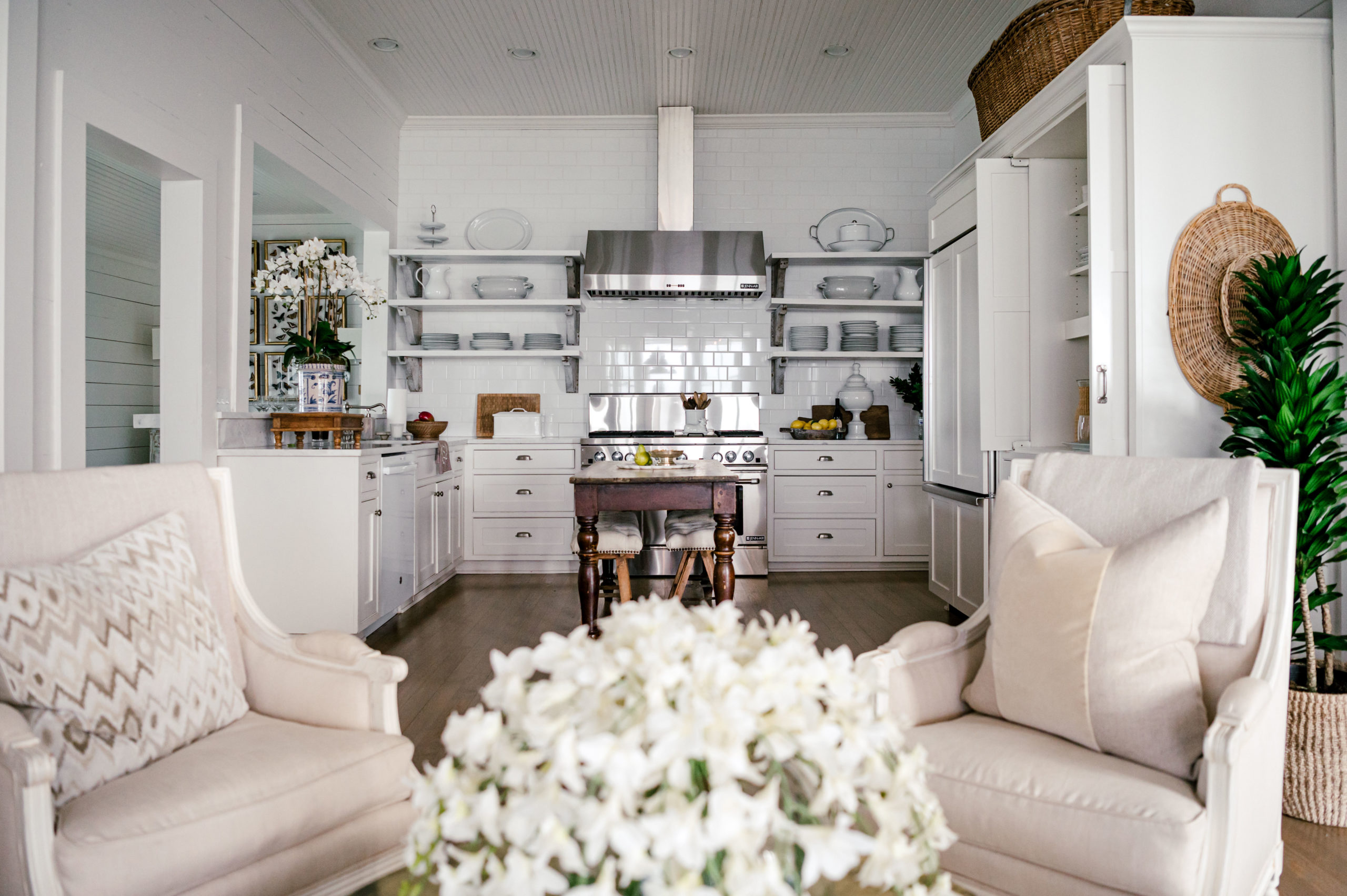 Interior Photography of living room swivel chairs and beautiful kitchen in the background 