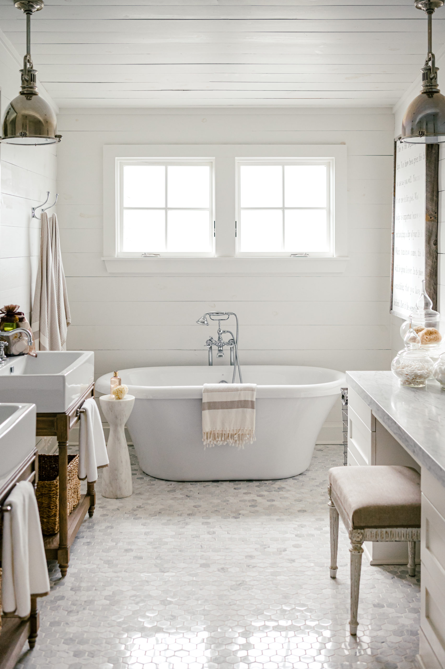 Interior photography of a beautiful white bathroom and a white Soaking Clawfoot Tub