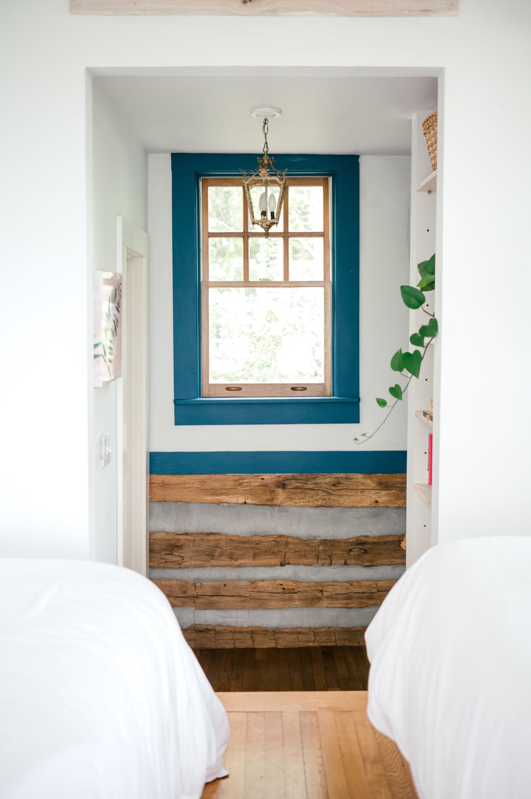 Professional Airbnb photography of air bnb cabin entryway with beautiful window lined with blue paint