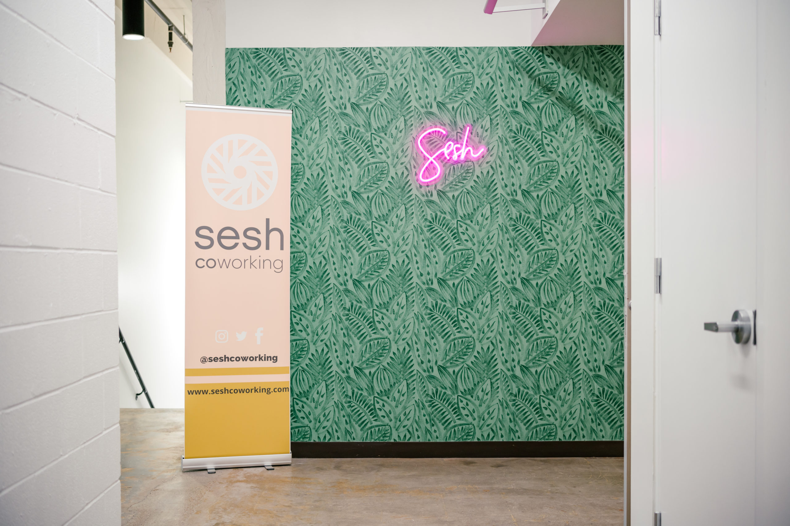 Photo of wall art with Sesh neon sign 