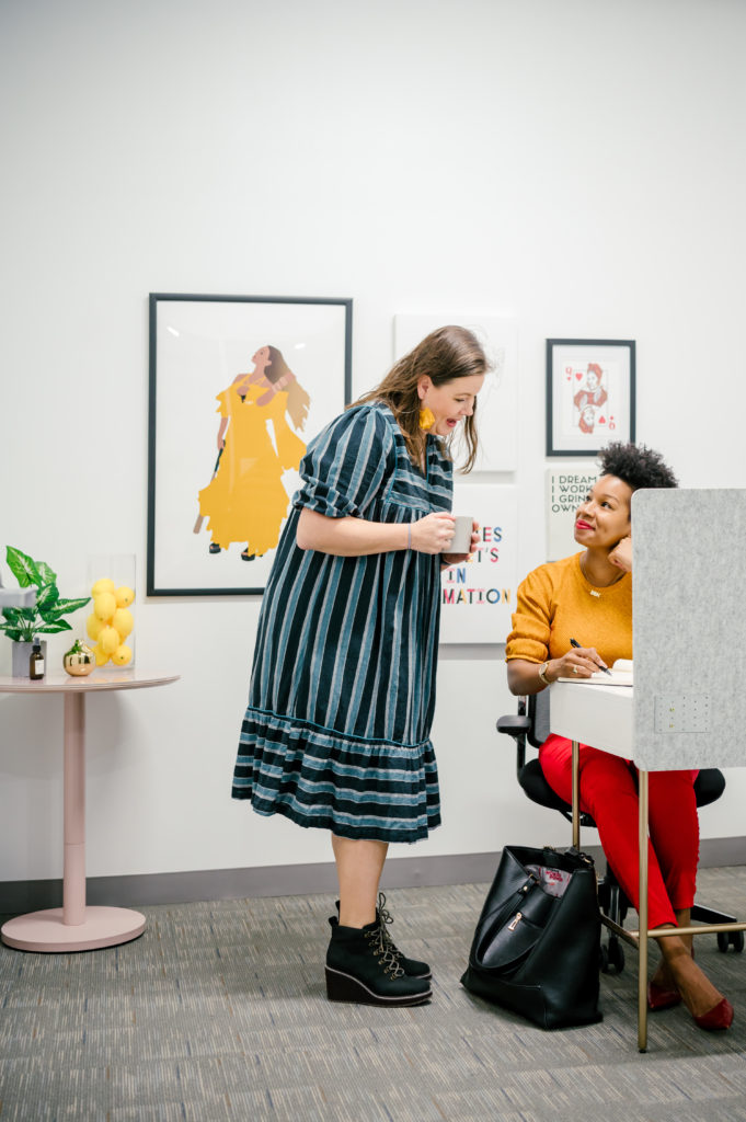 Personal Brand Photography of a women chatting in an office at Sesh coworking community