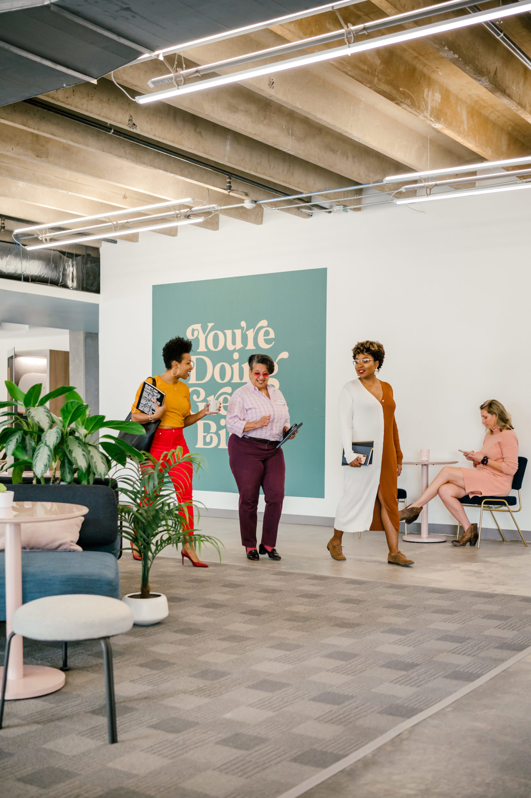 Personal Brand Photography of women walking into the office workspace talking