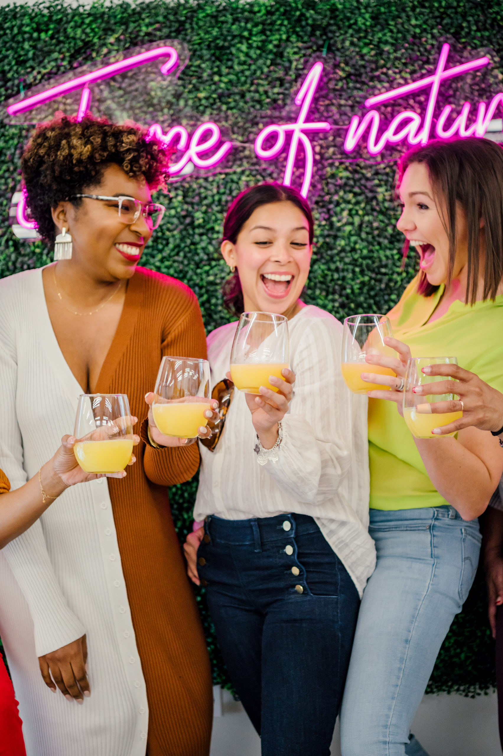 Personal Brand Photography of women laughing and smiling toasting their glasses