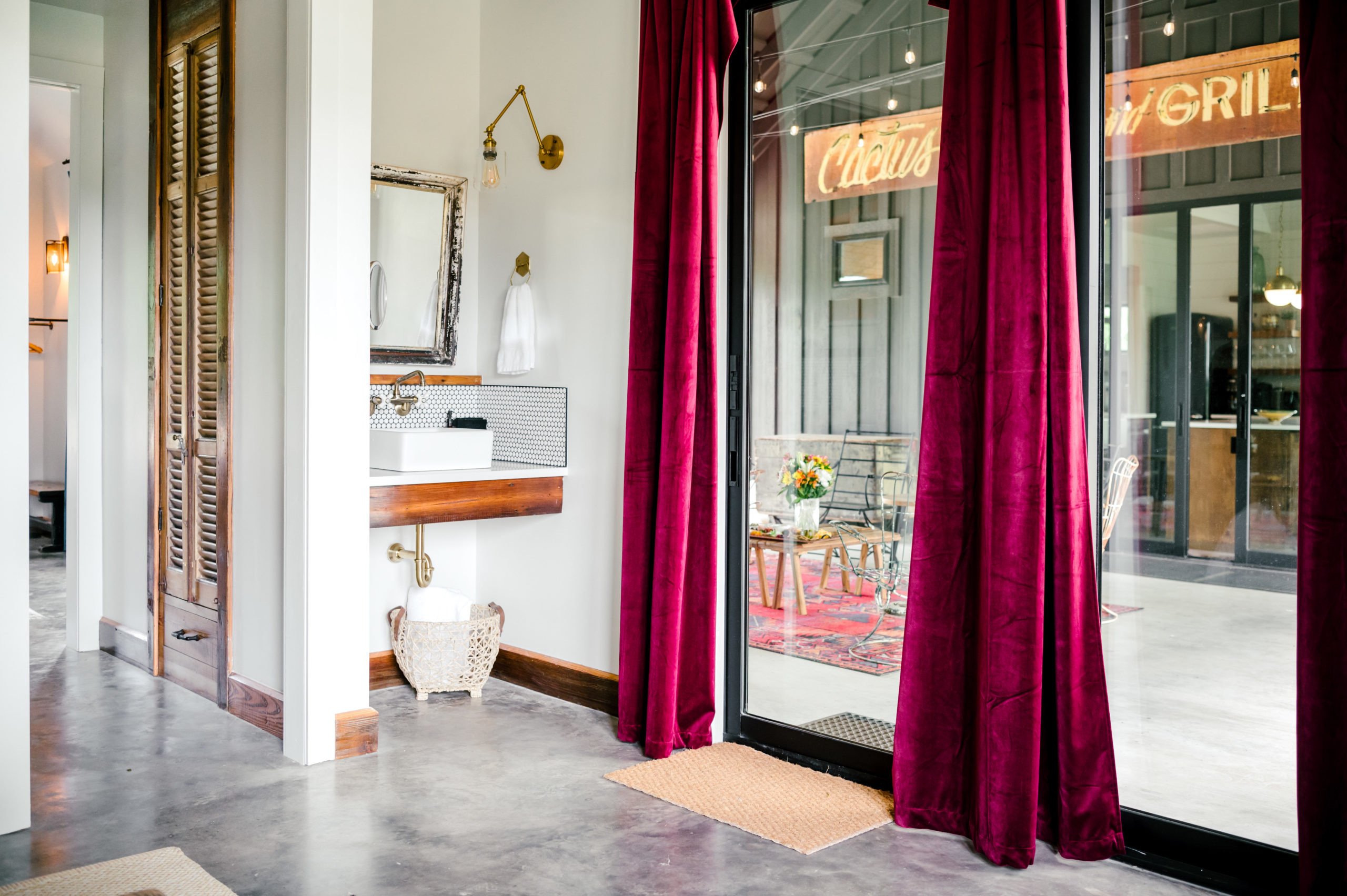Master bathroom with burgandy velvet curtains 
