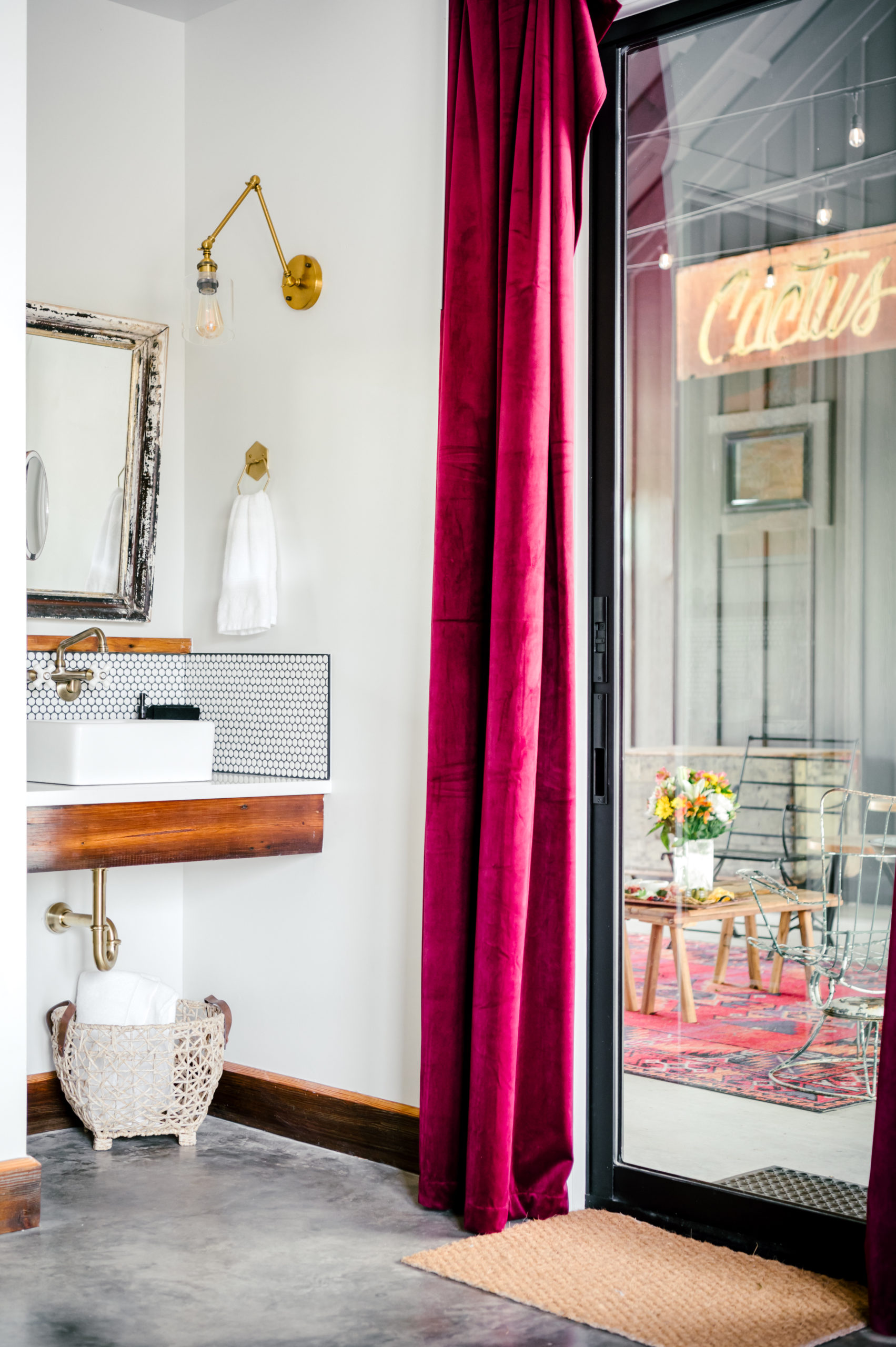 Master bathroom with burgandy velvet curtains 