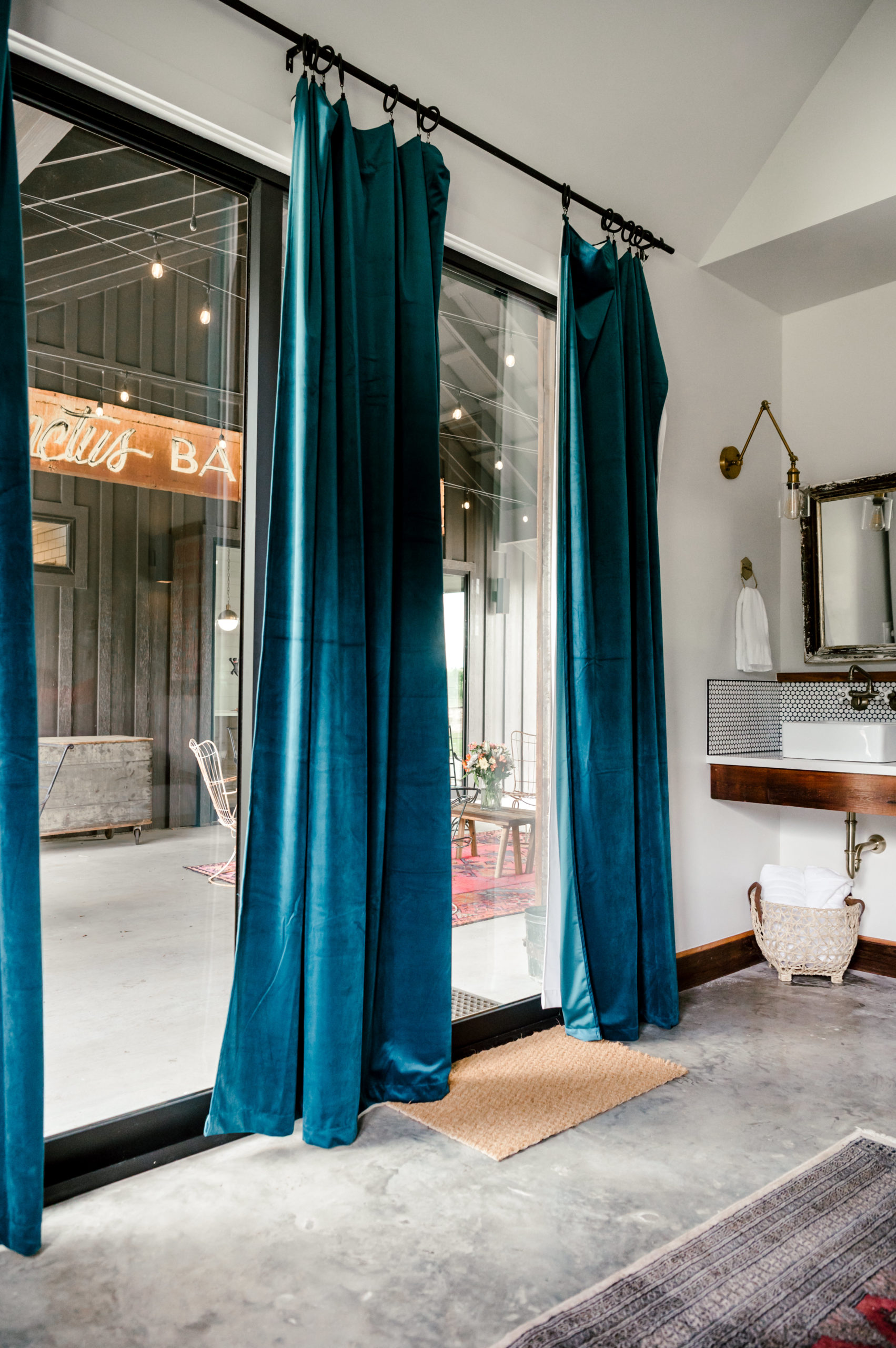 Blue velvet curtains hanging on the sliding glassdoor