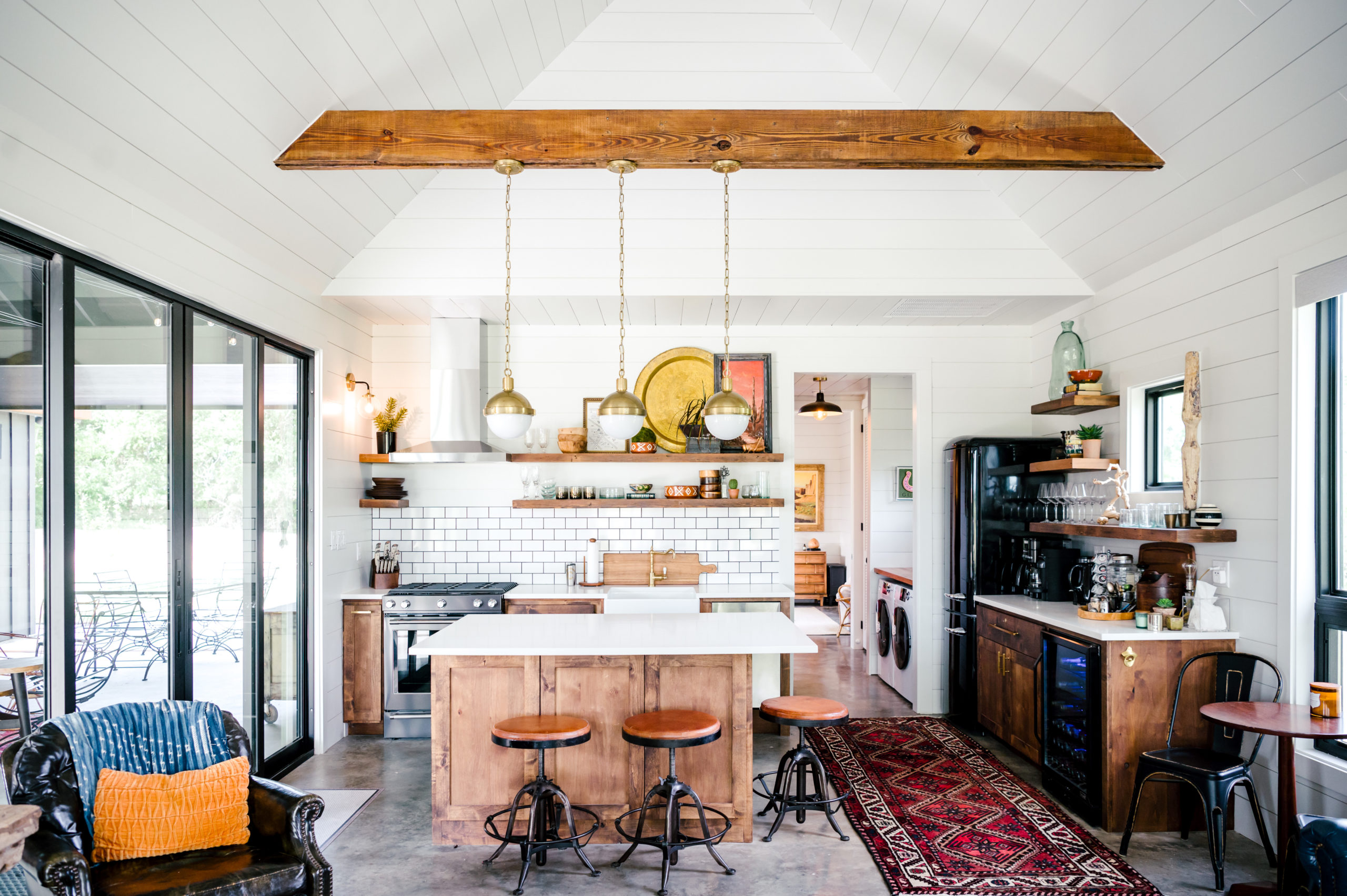 Kitchen interior with a kitchen island and stools 