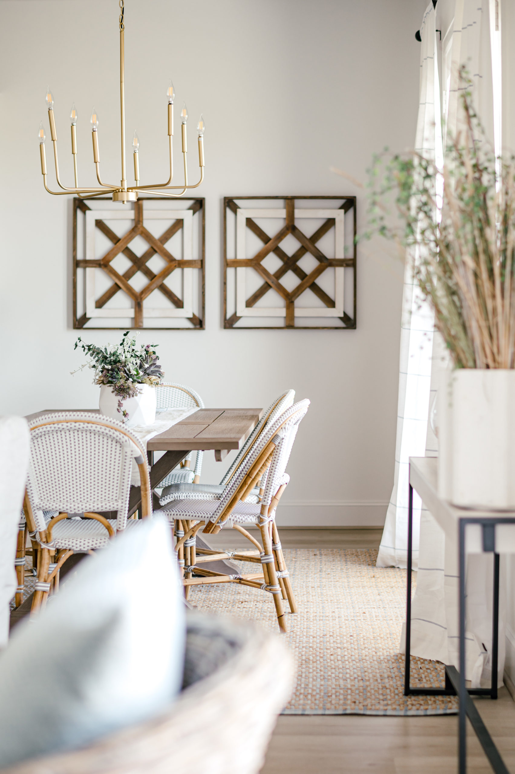 Beach house outdoor patio chairs sitting next to wooden dining room table