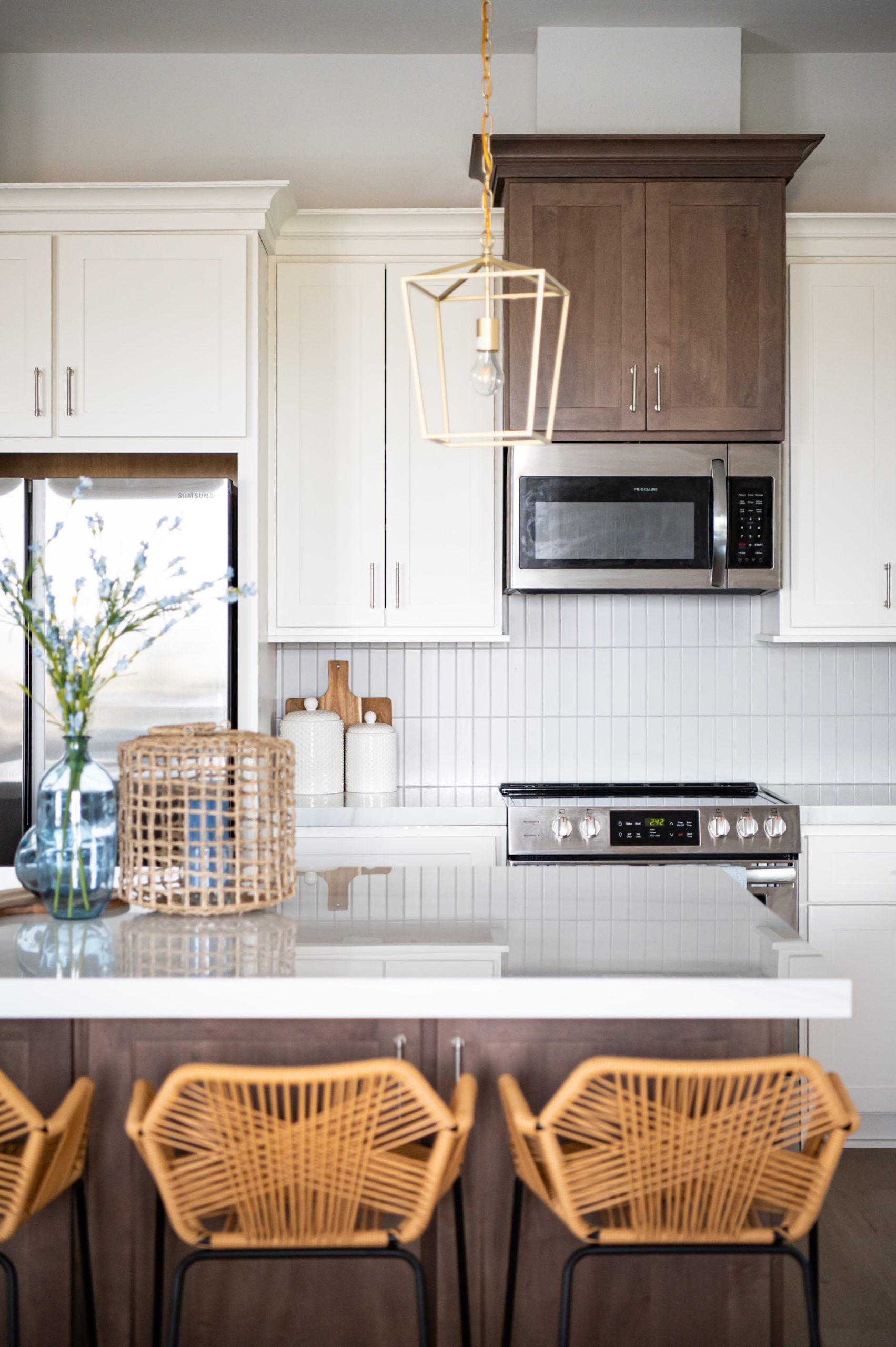 Rattan counter bar stools sitting next to white kitchen counter