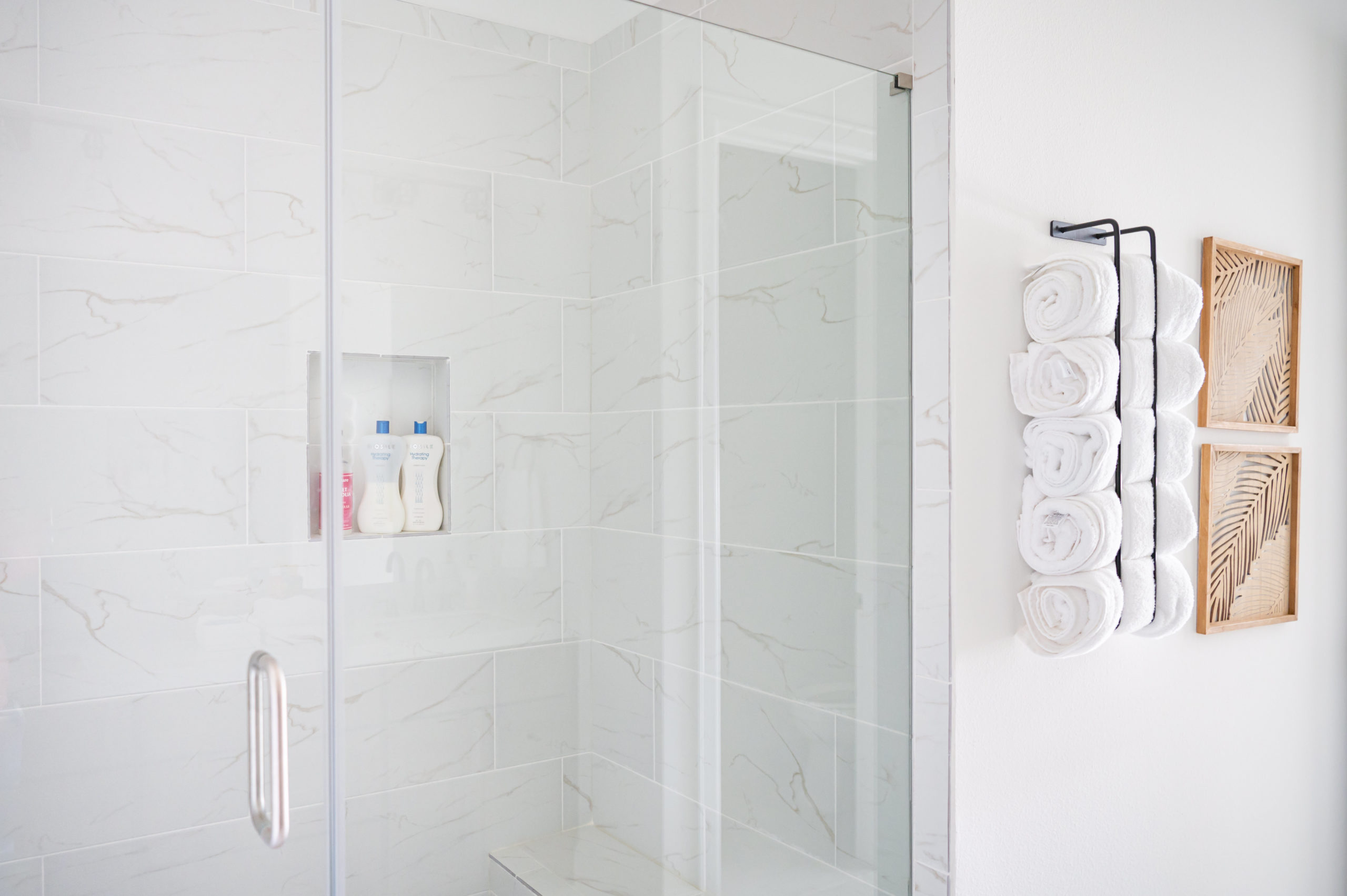 Vacation Rental Photography photos of Master bathroom shower with marble walls and glass door