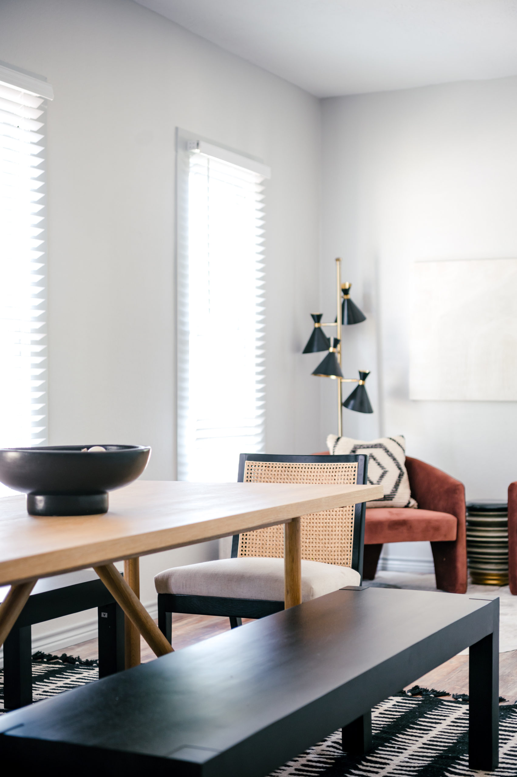 Modern black dining room table with cane dining chair