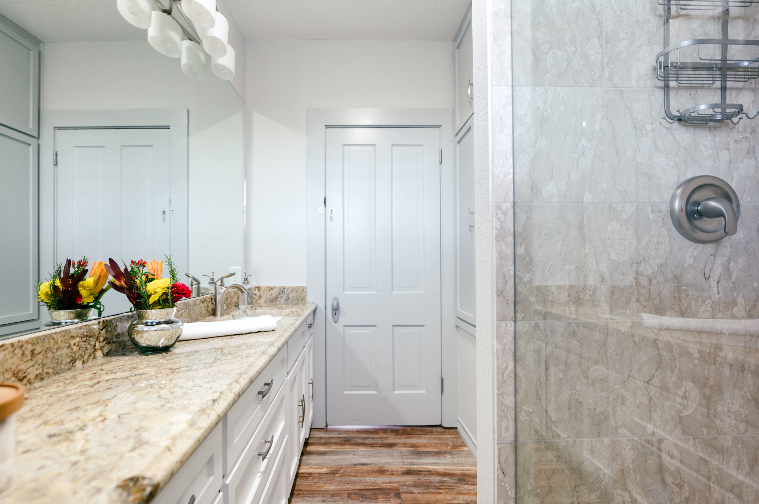 Bathroom marble sink and wooden floor