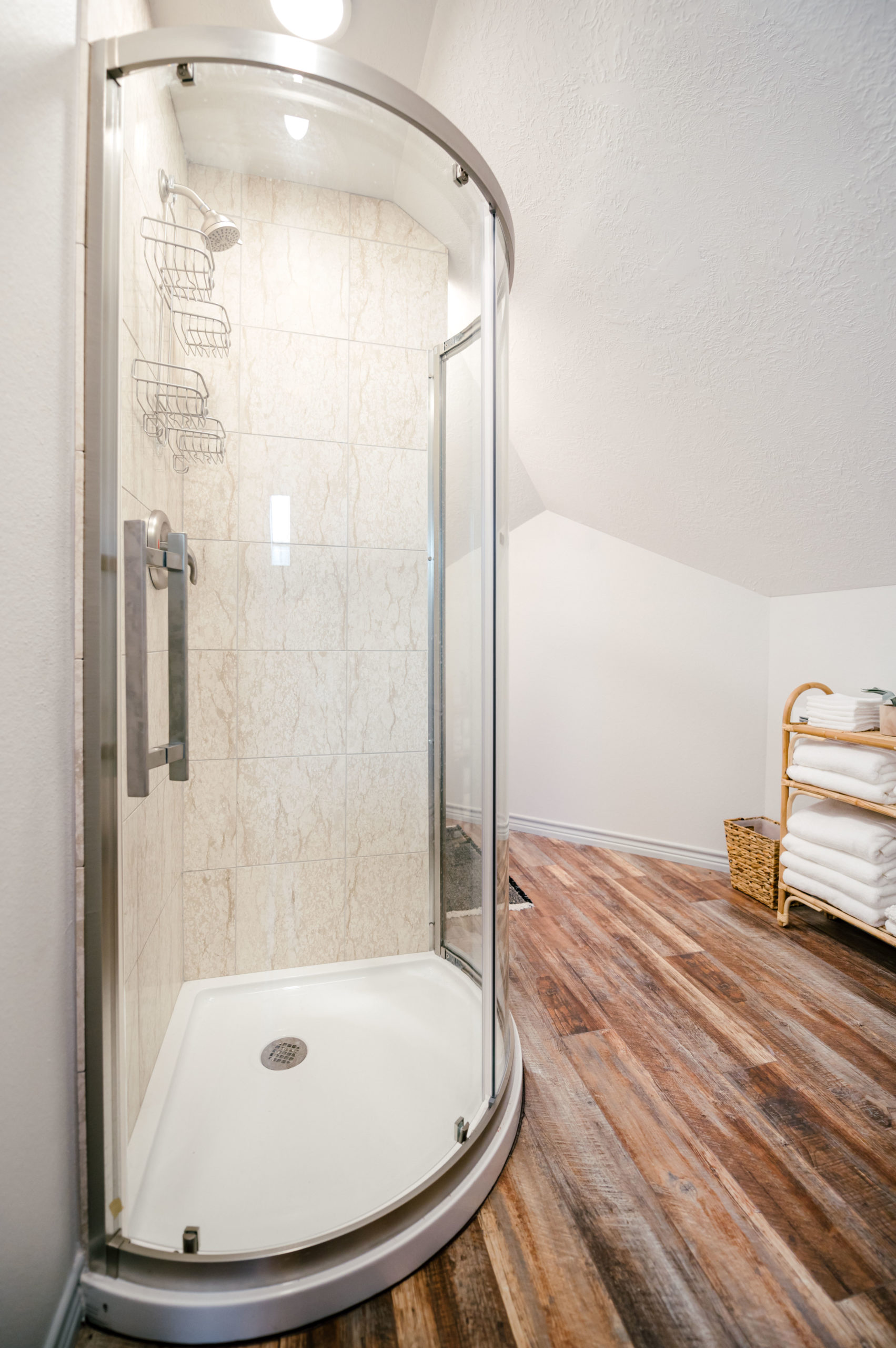 Round Corner shower on hard wood floor