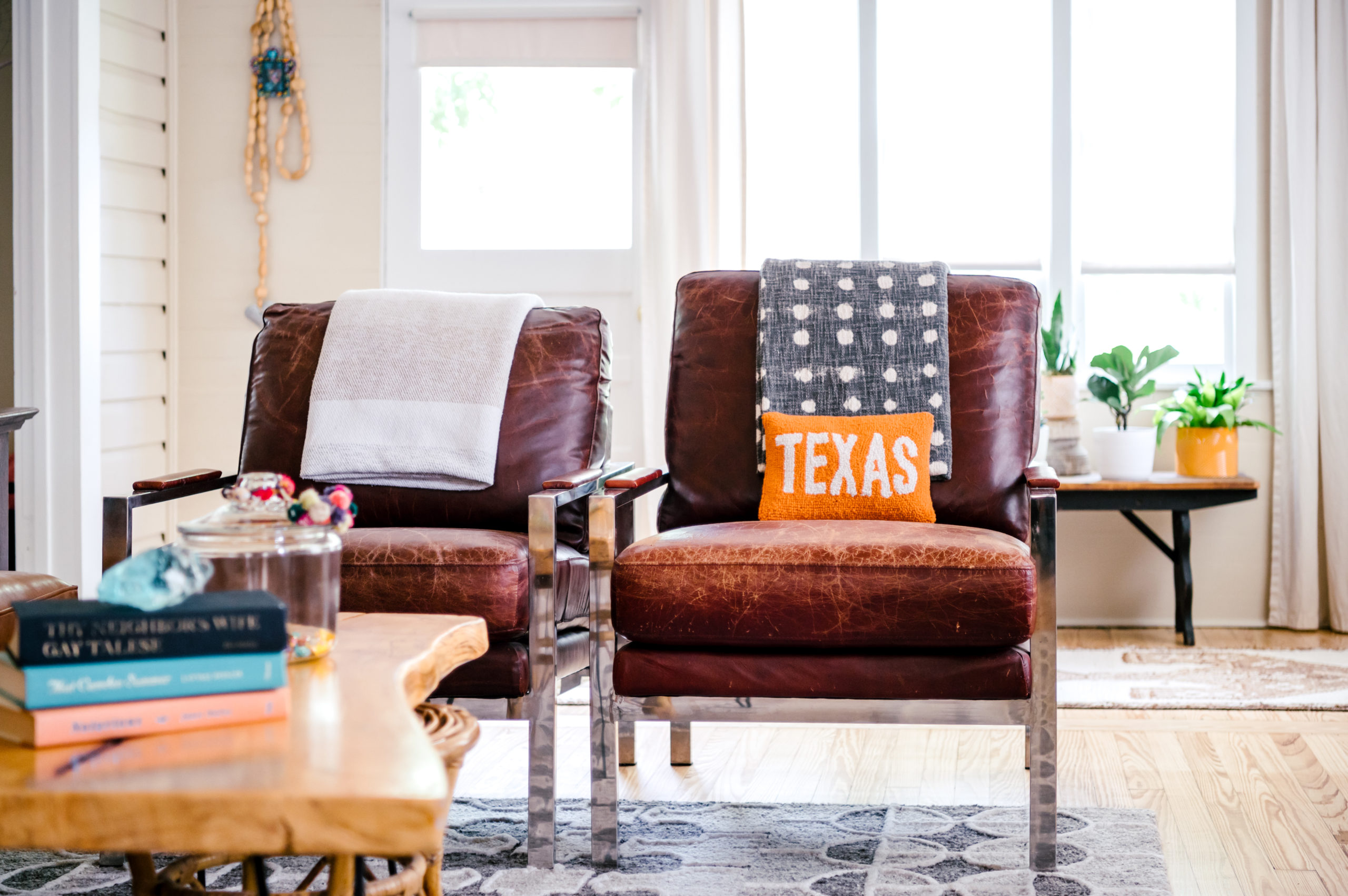 Short-term Rental Photos of living room leather seats and wooden coffee table