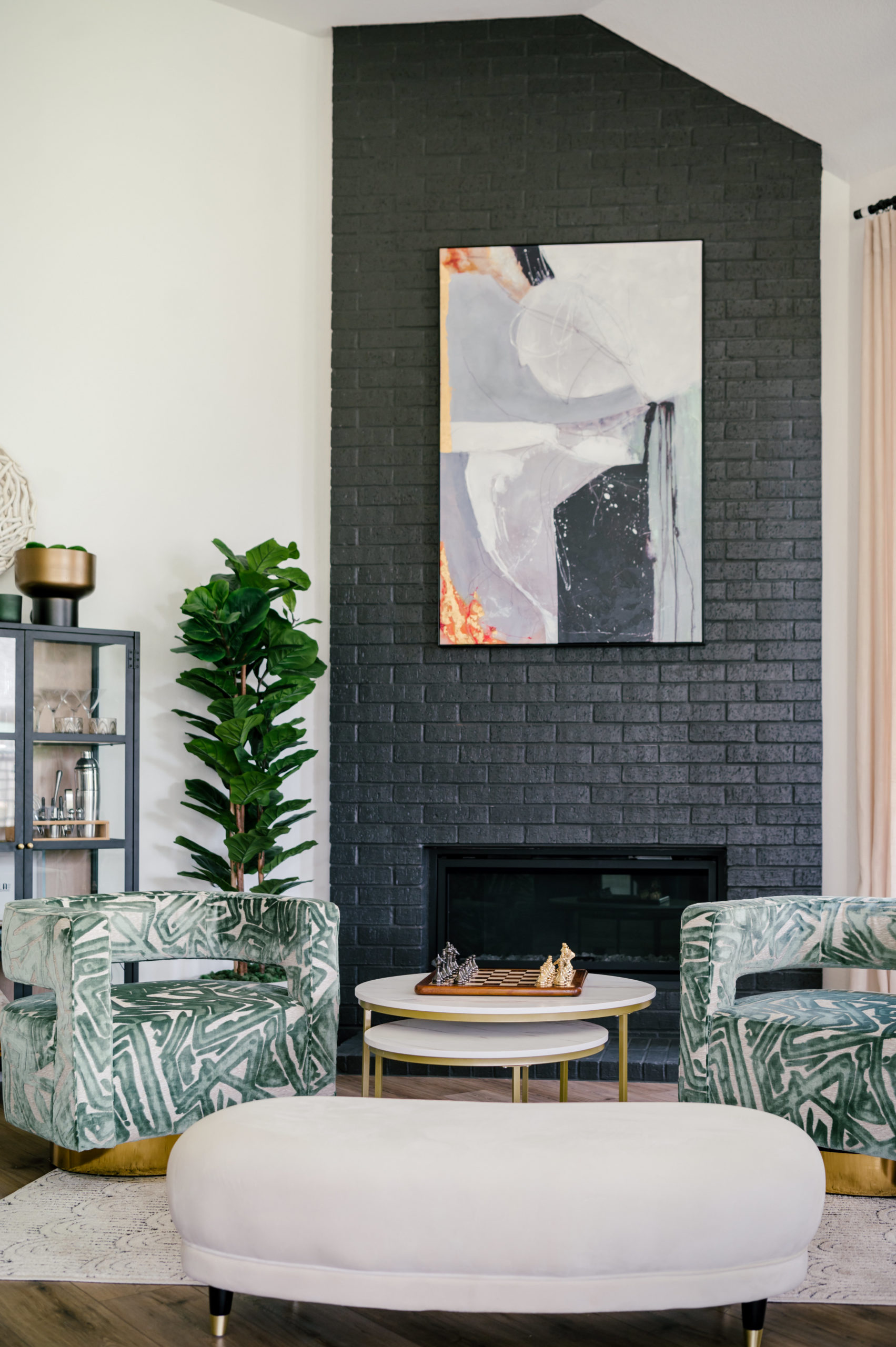 Professional interior photography of living room interior, green love seat and circle table with a chess board