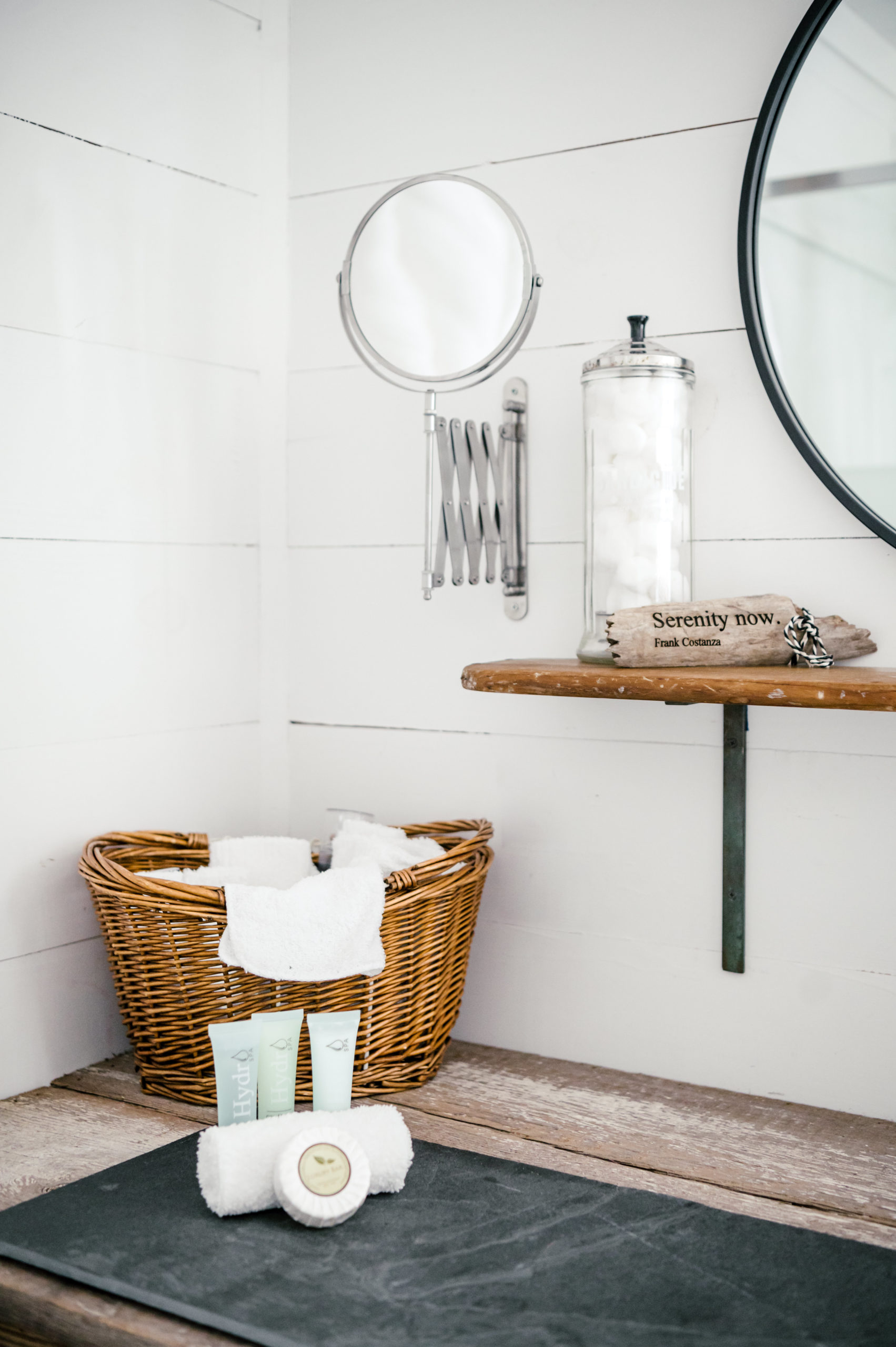 Wicker basket with white towels in bathroom 