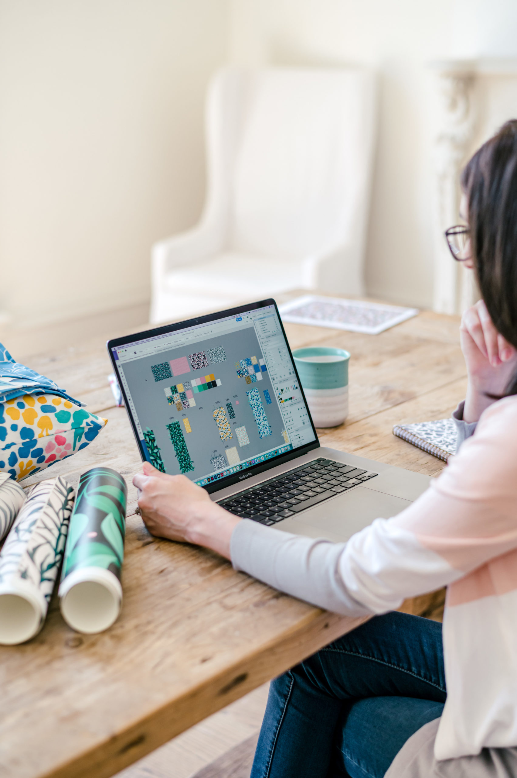 Woman designer working on her illustration designs on her laptop