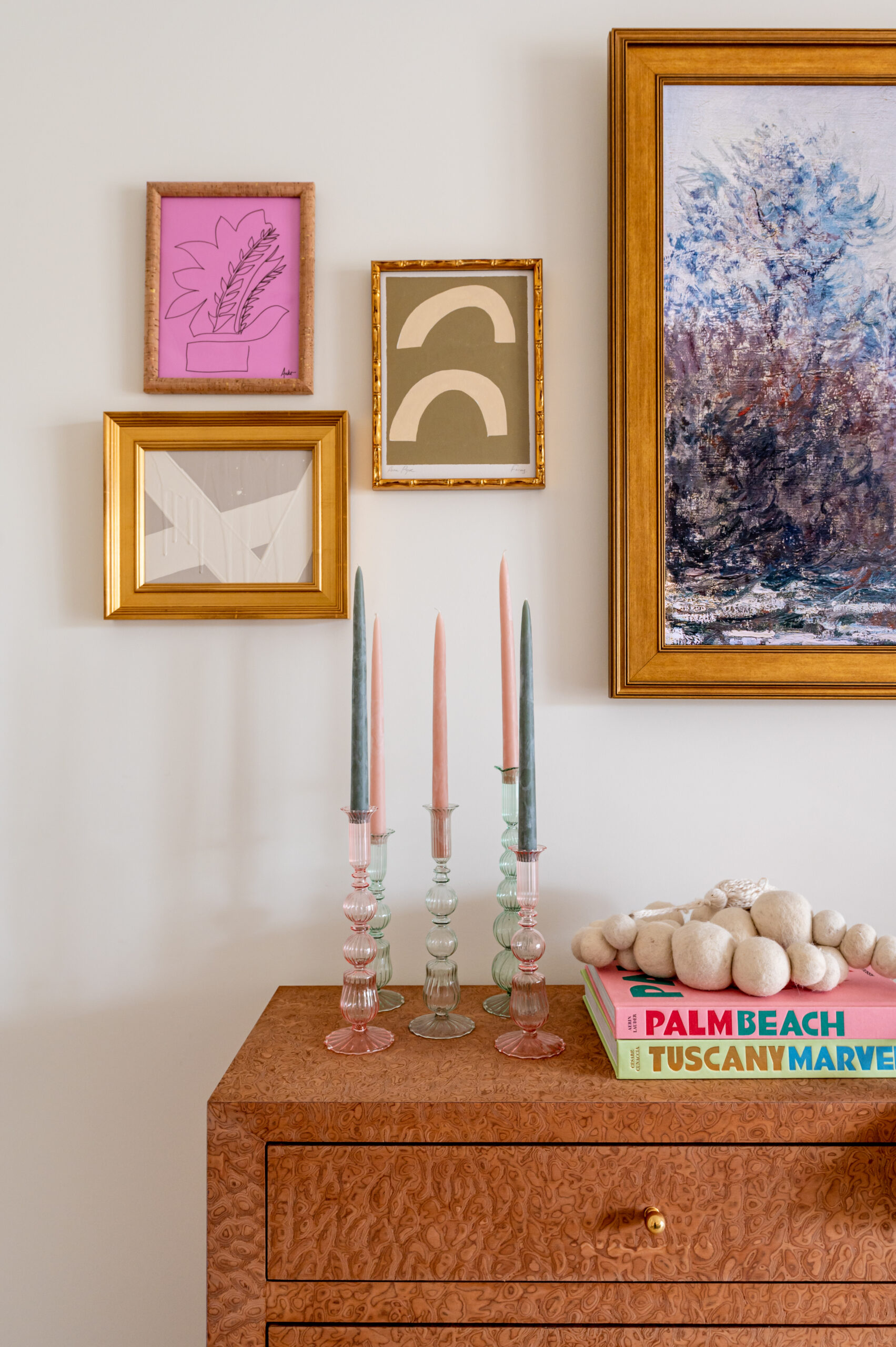 Side table with candles and wall art