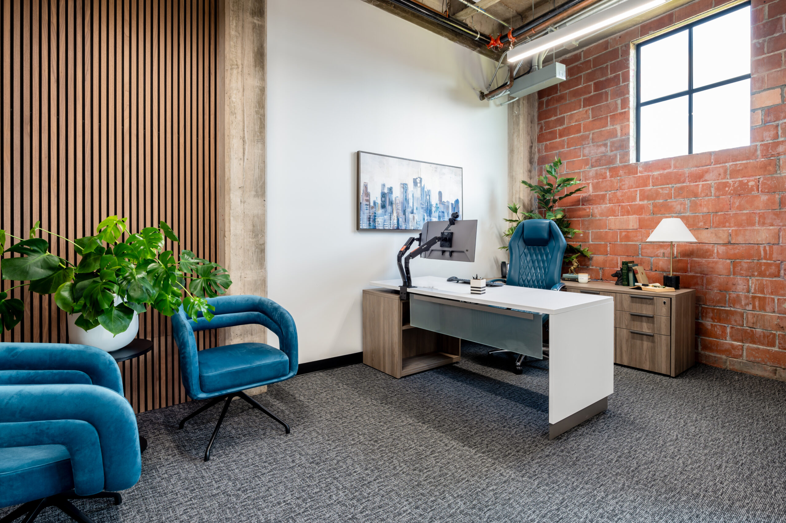 Industrial interior design office space with brick walls
