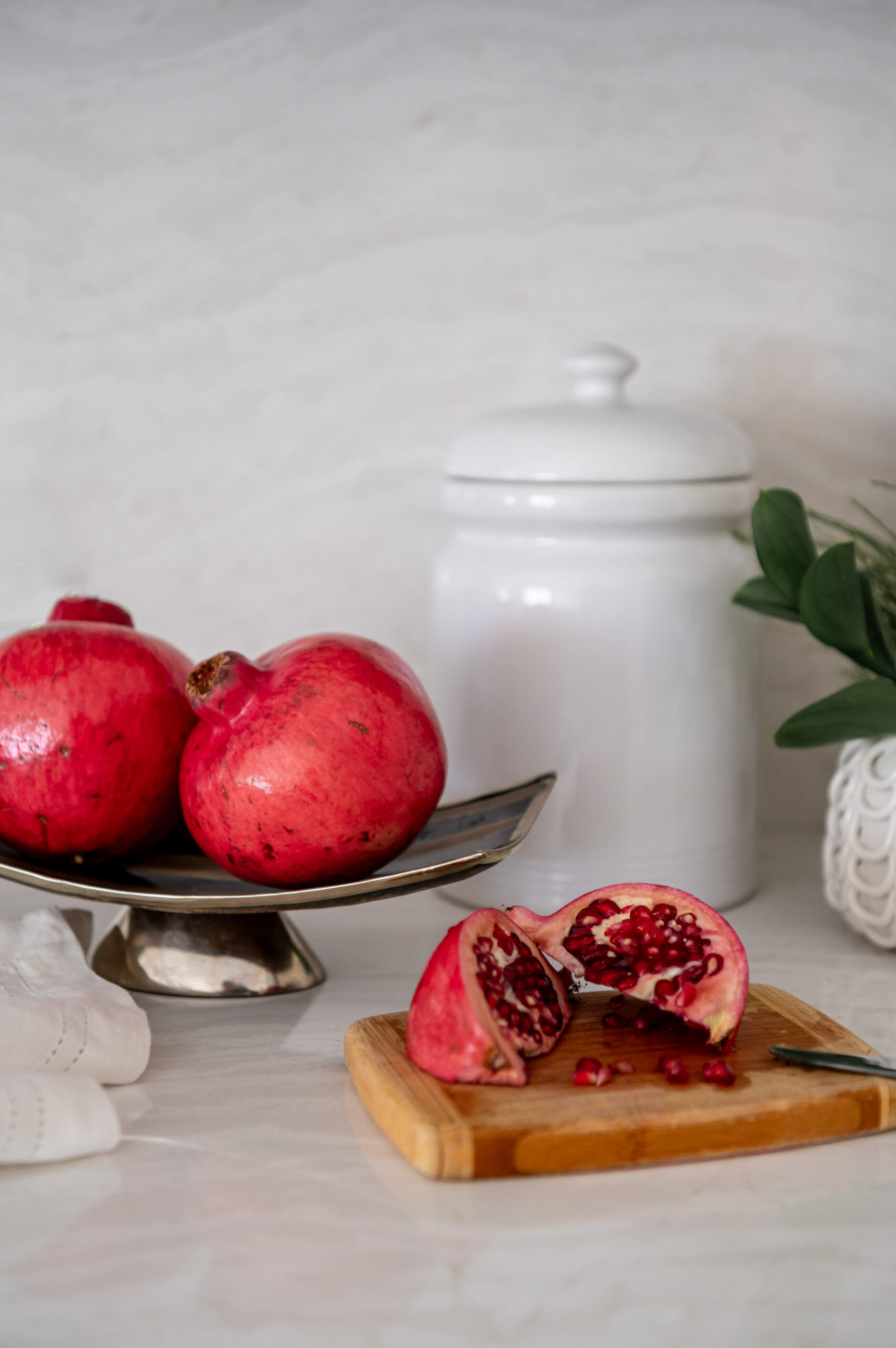 Cut pomegranate in a beautiful kitchen