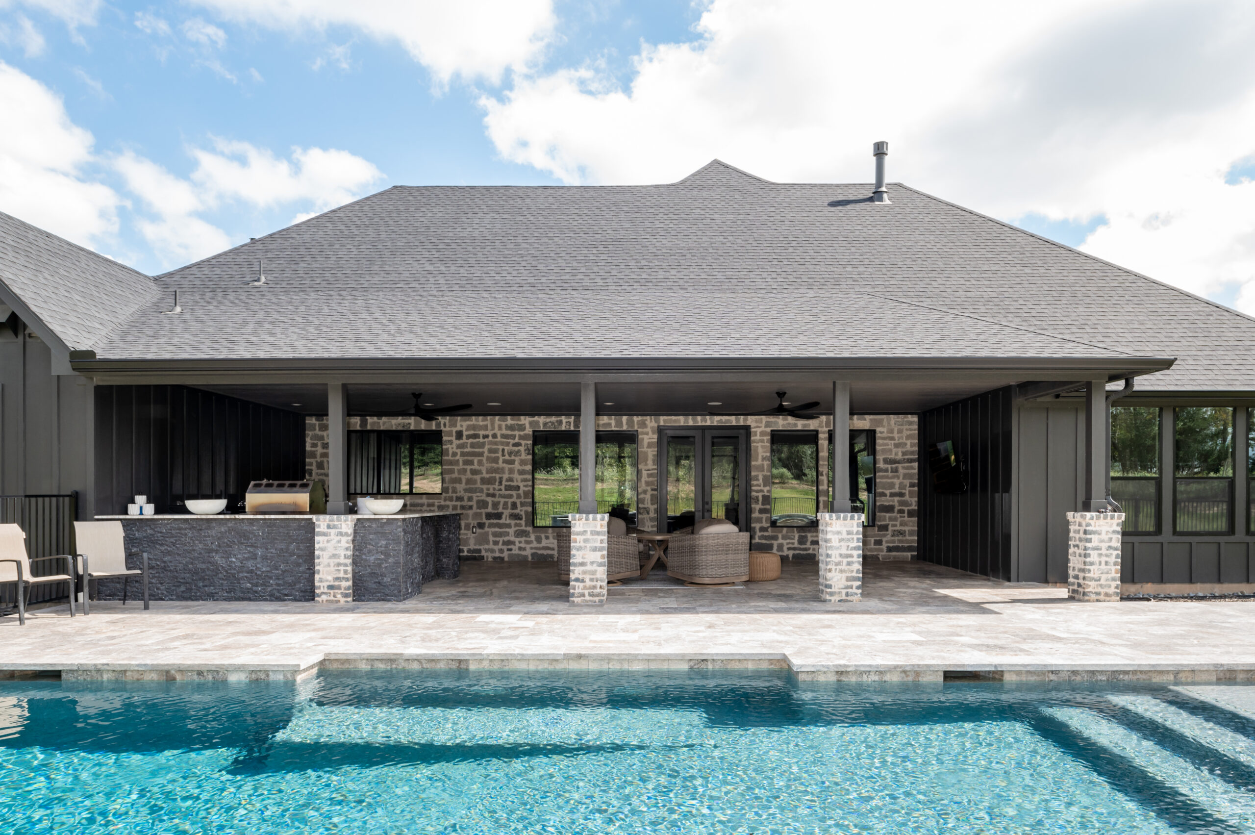 Exterior photography for a beautiful Texas home with stunning brickwork and a pool
