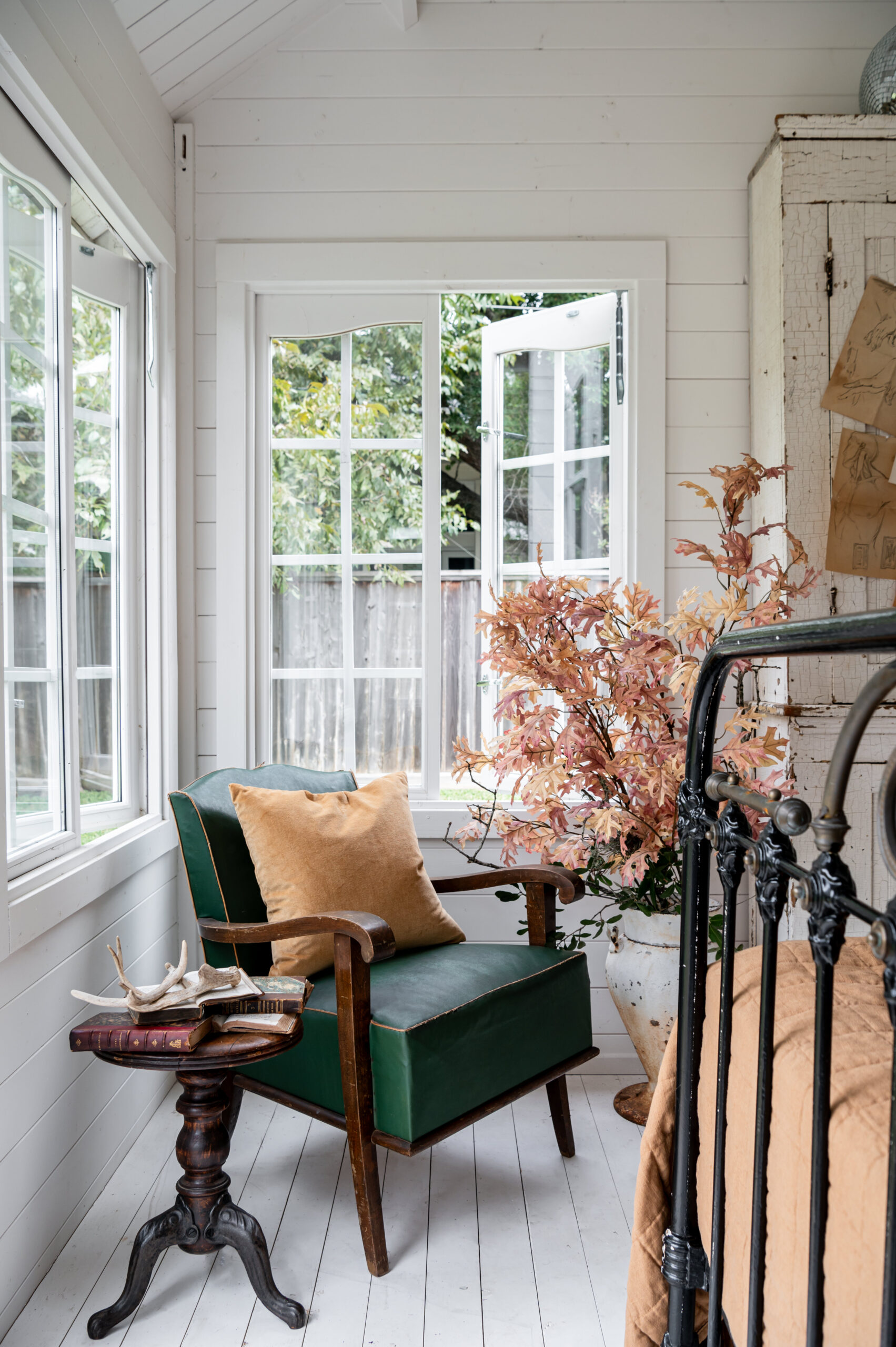 Beautiful bedroom interior with vintage arm chair and bed