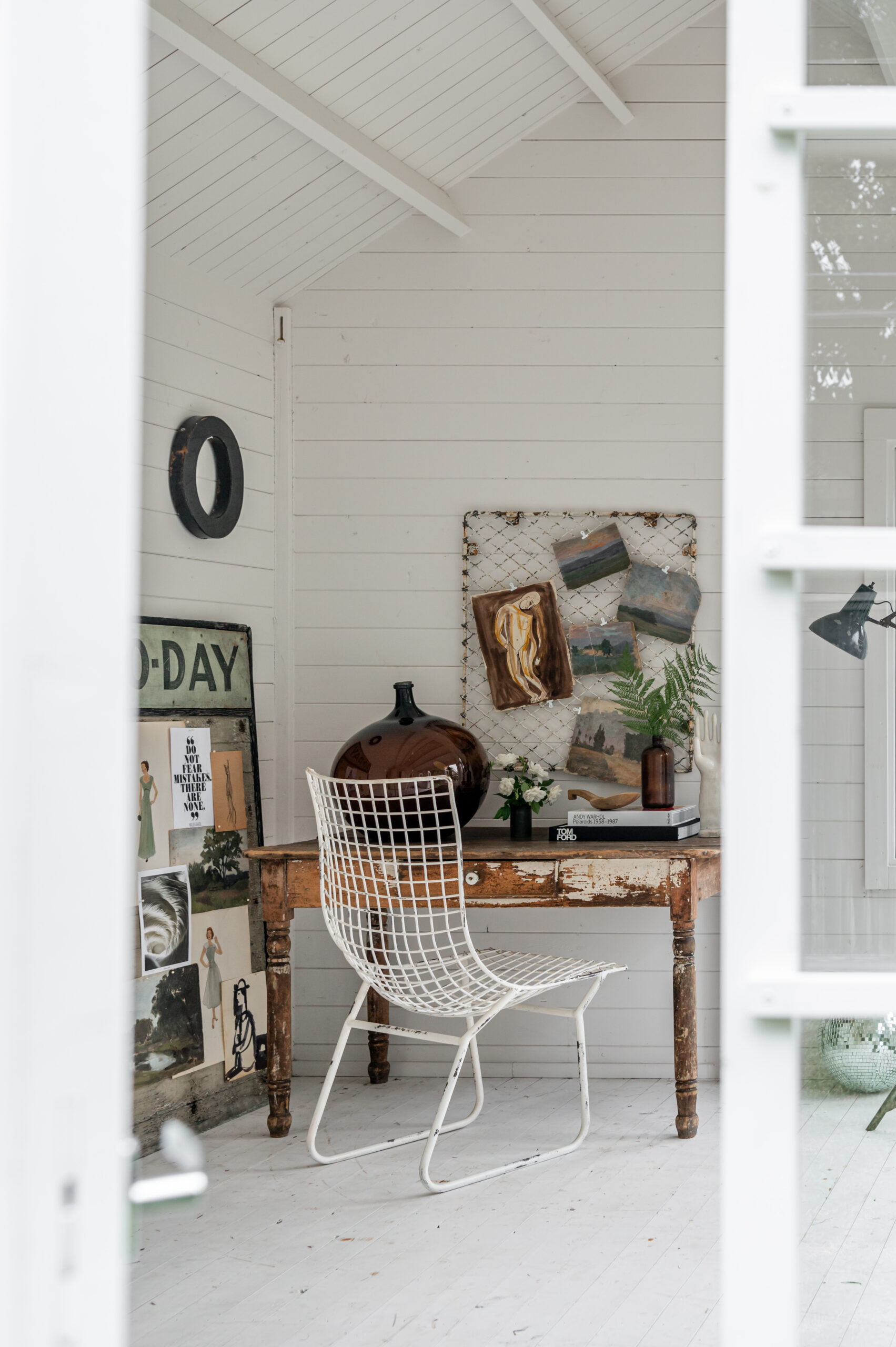 Vintage wooden desk with modern and antique decor