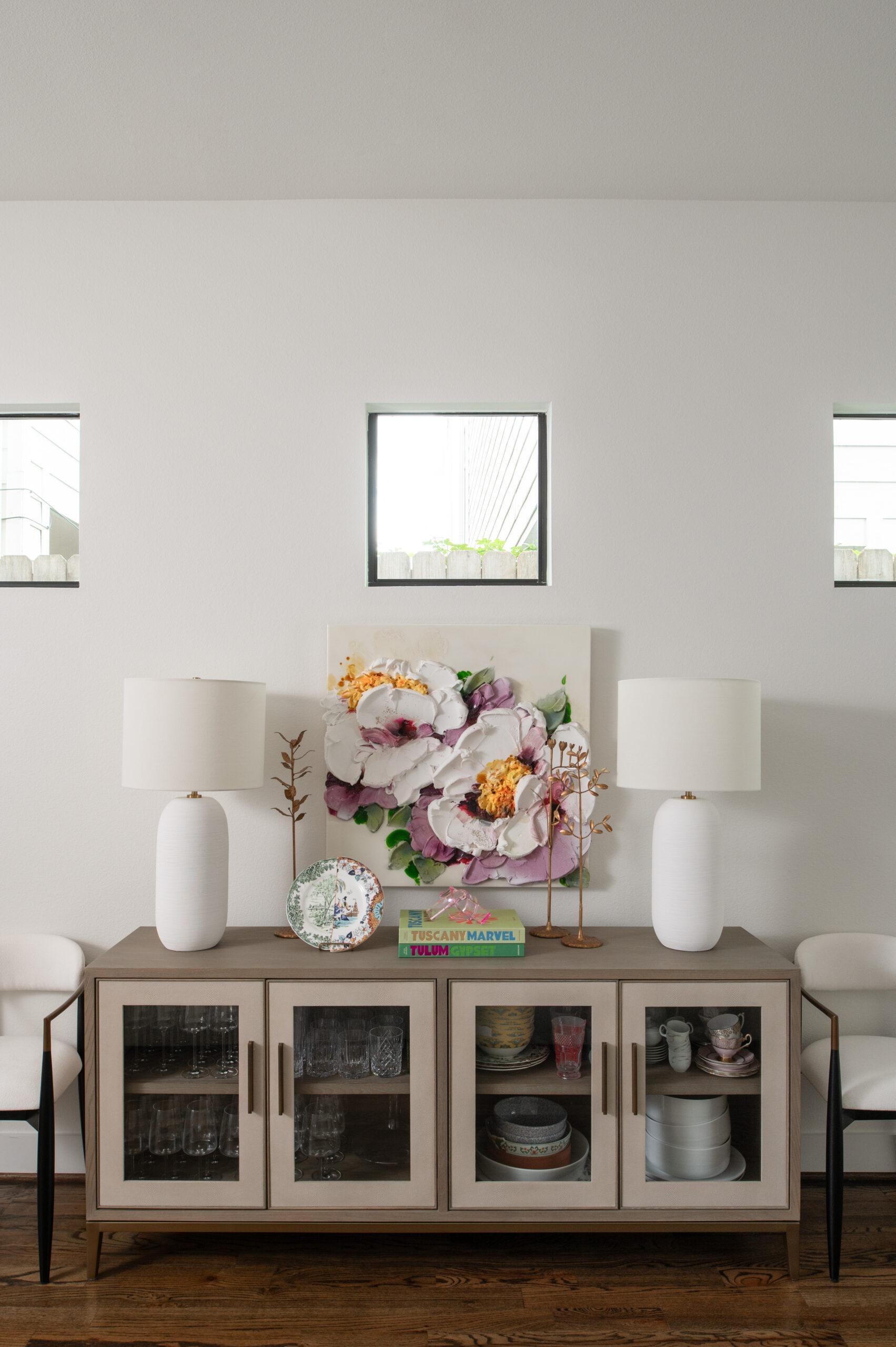 Dining room interior design with neutral cabinets and beautiful decor