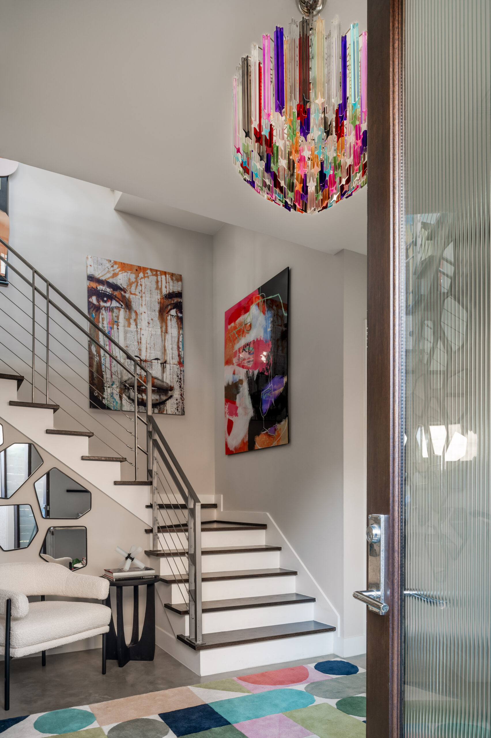 Funkiest art, wall of mirrors, and the Murano glass chandelier from Italy