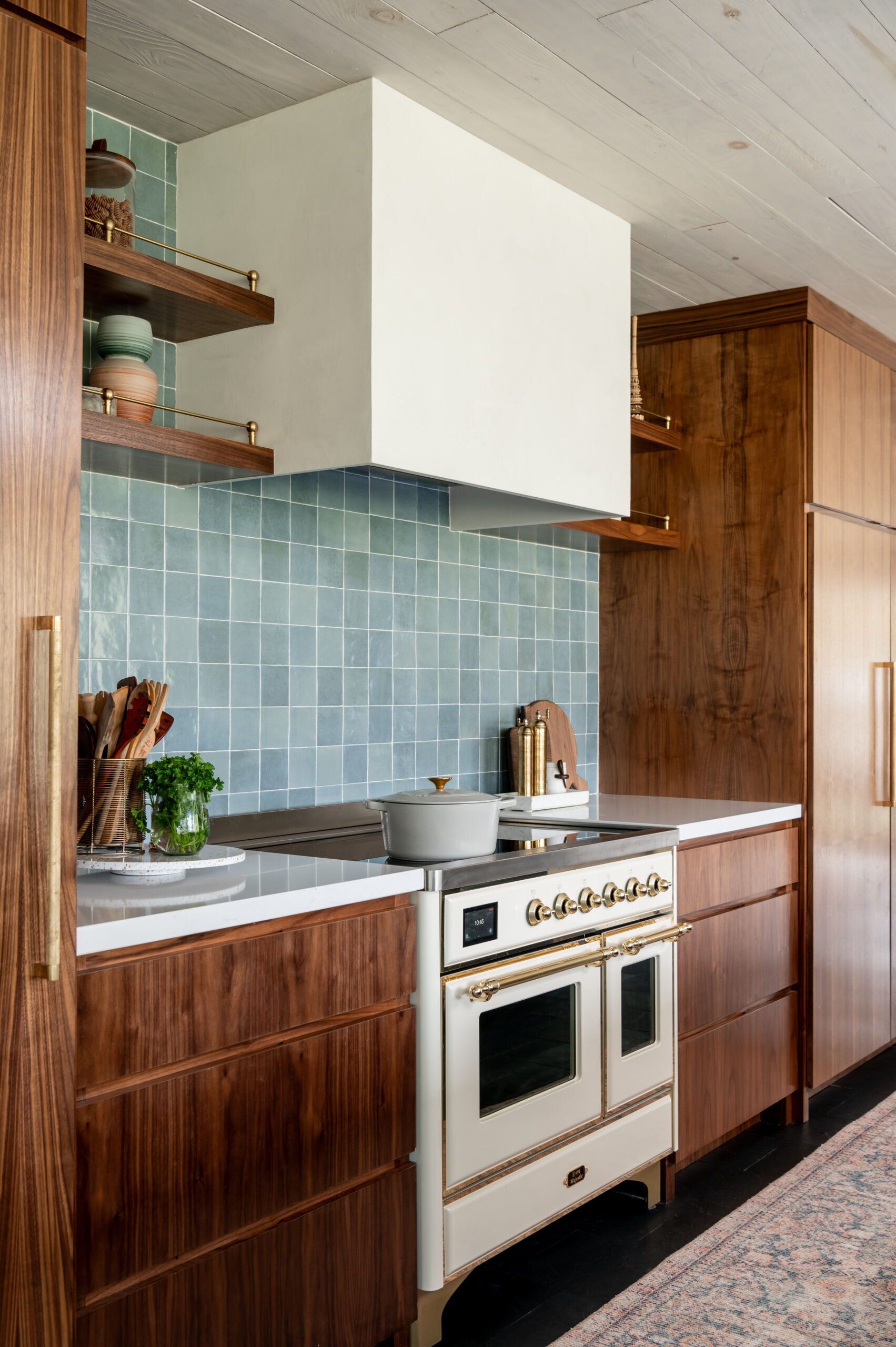 Midcentury kitchen interior design, with tile backsplash and wood cabinets