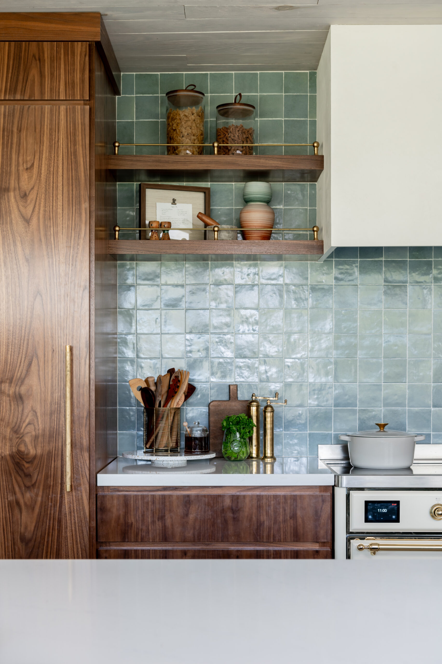 Midcentury kitchen interior design, with tile backsplash and wood cabinets