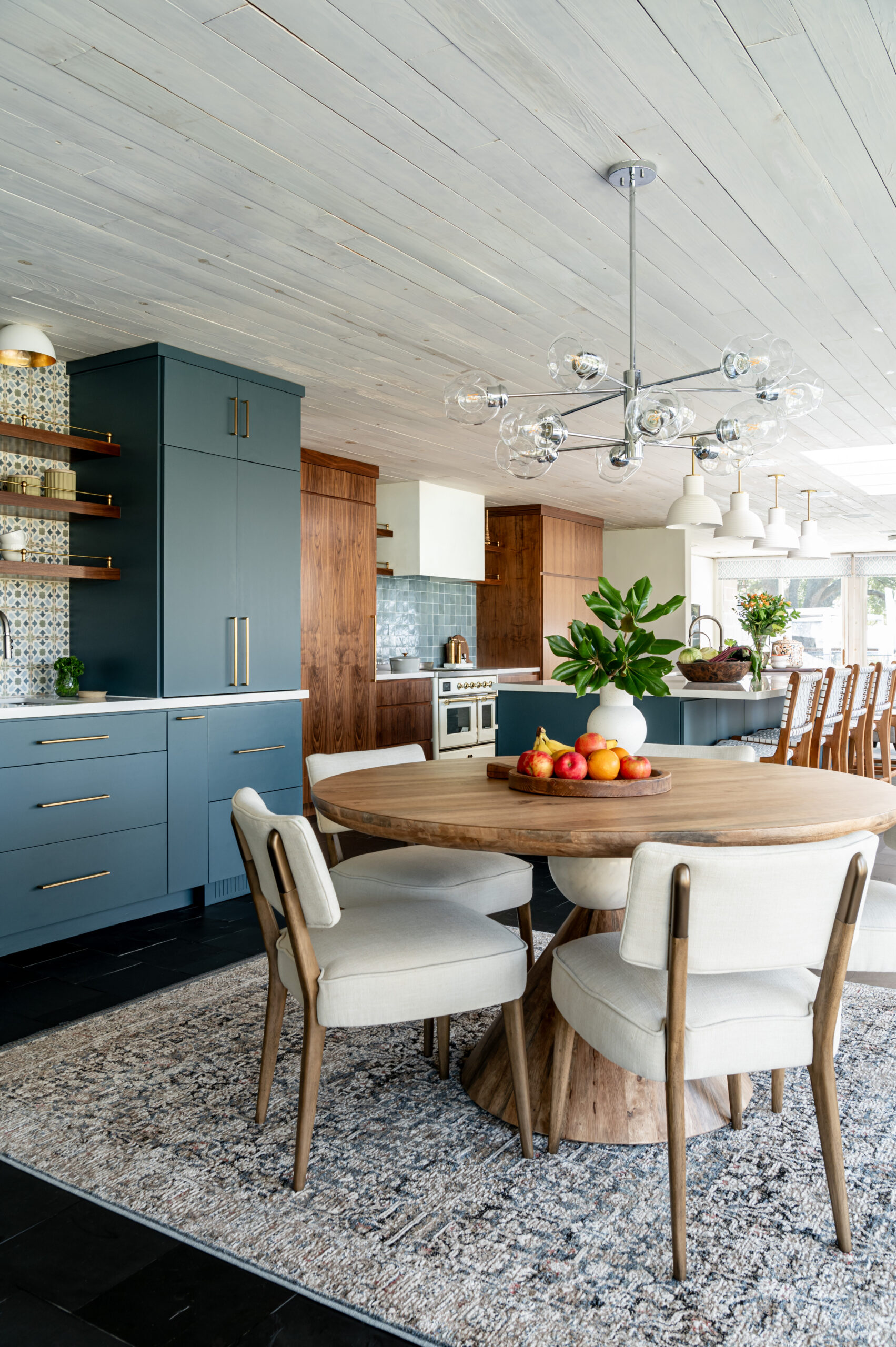 Midcentury kitchen interior design, with tile backsplash and wood cabinets