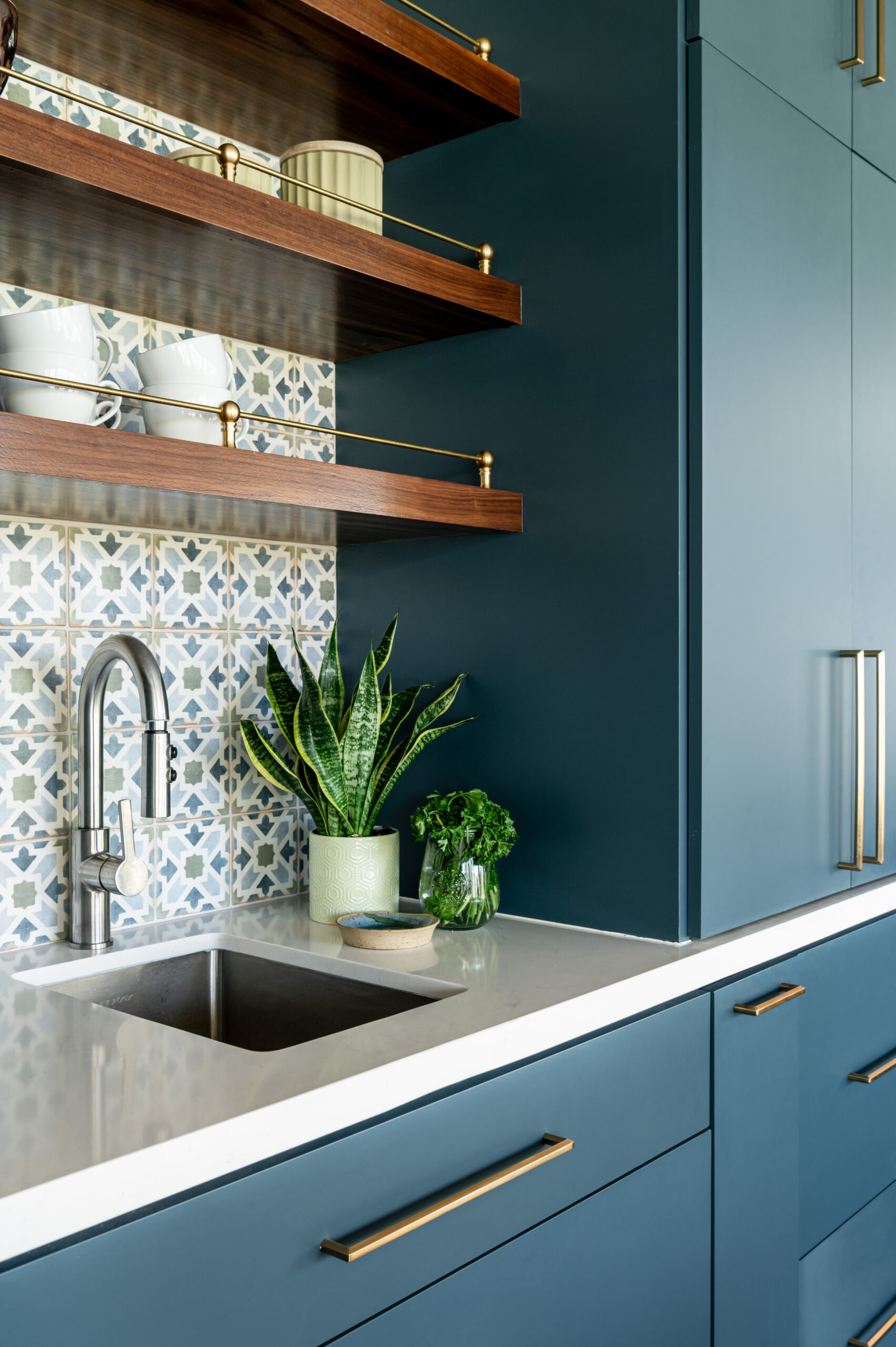 Midcentury kitchen interior design, with blue cabinetry