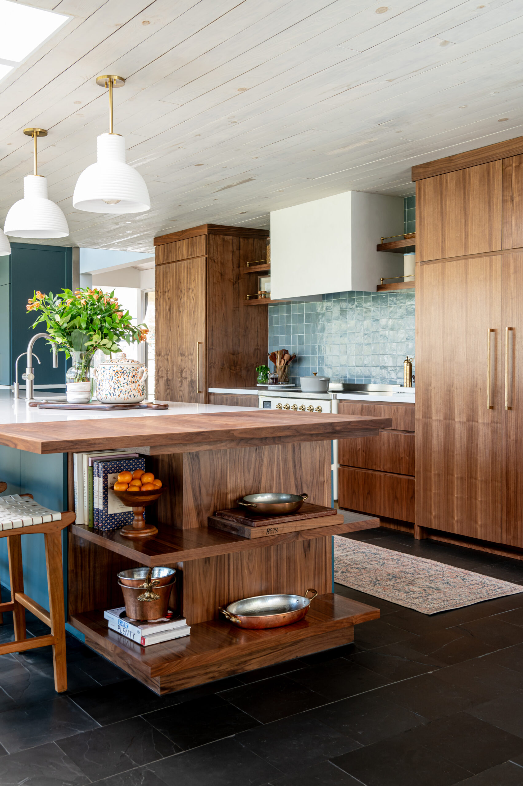 Midcentury kitchen interior design, with tile backsplash and wood cabinets