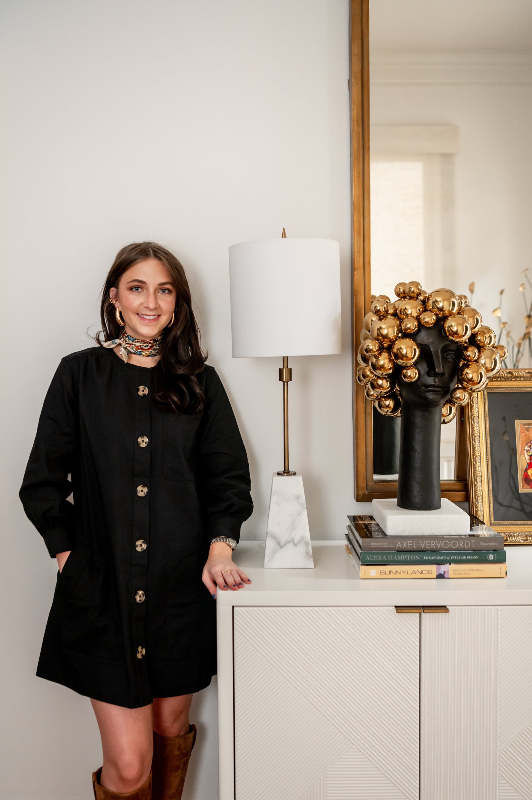 A women interior designer smiling posing for her interior design brand shoot