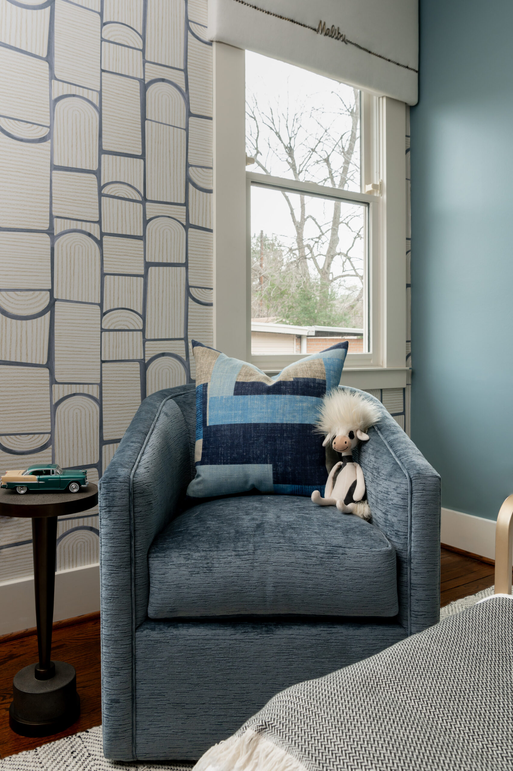 Blue side chair with kids toy