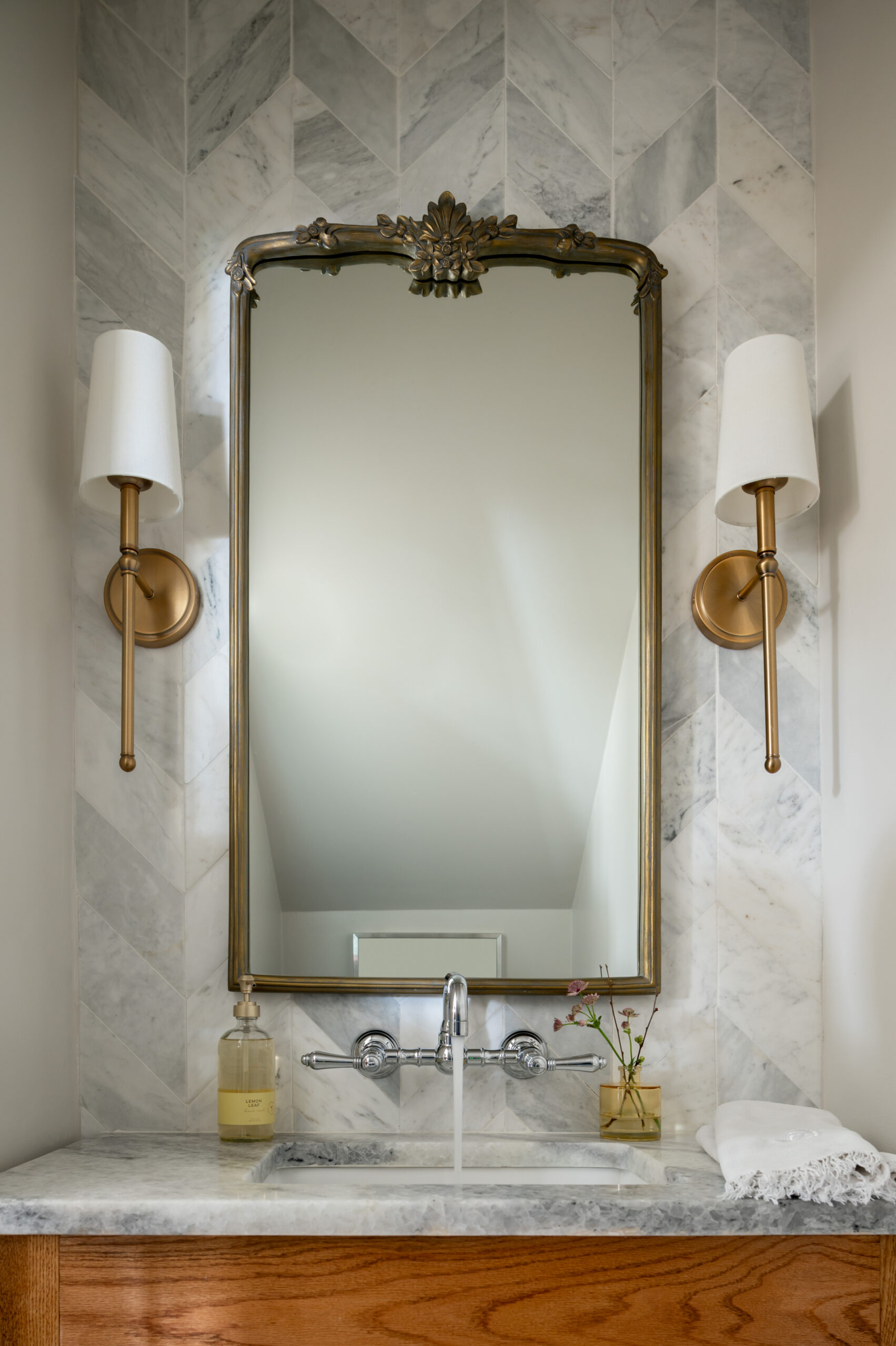 Marble bathroom sink with faucet running water