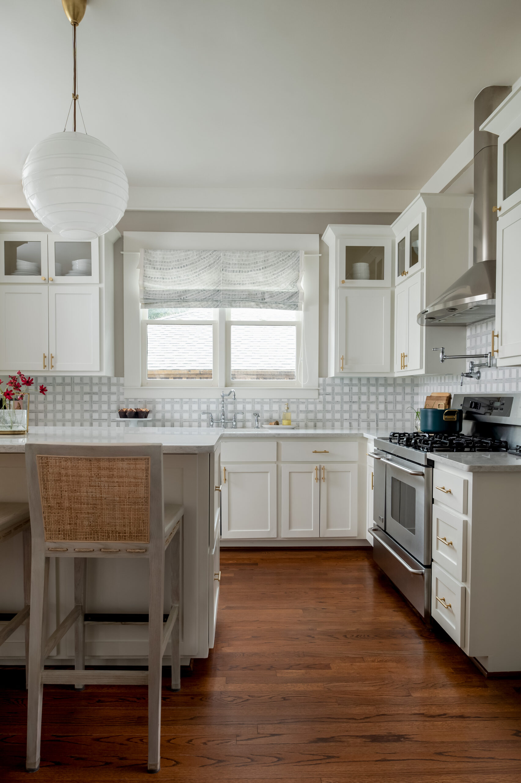 Luxury kitchen interior design with white cabinets and wood flooring