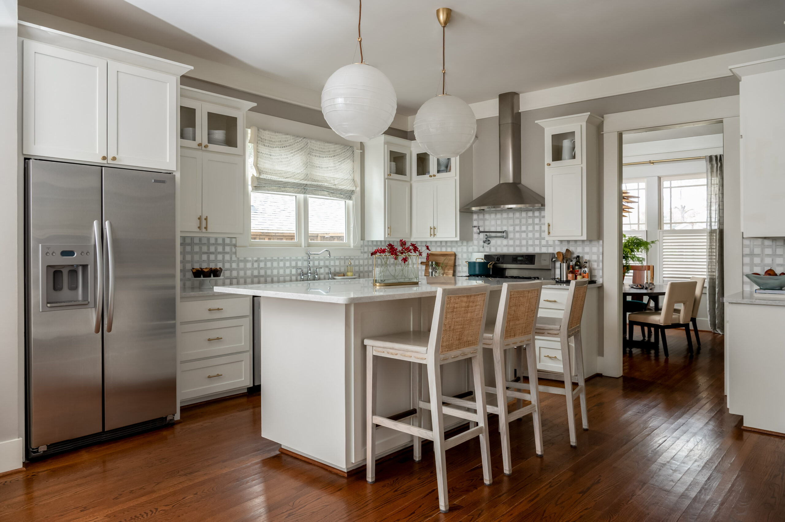 Luxury kitchen interior design with white cabinets and wood flooring