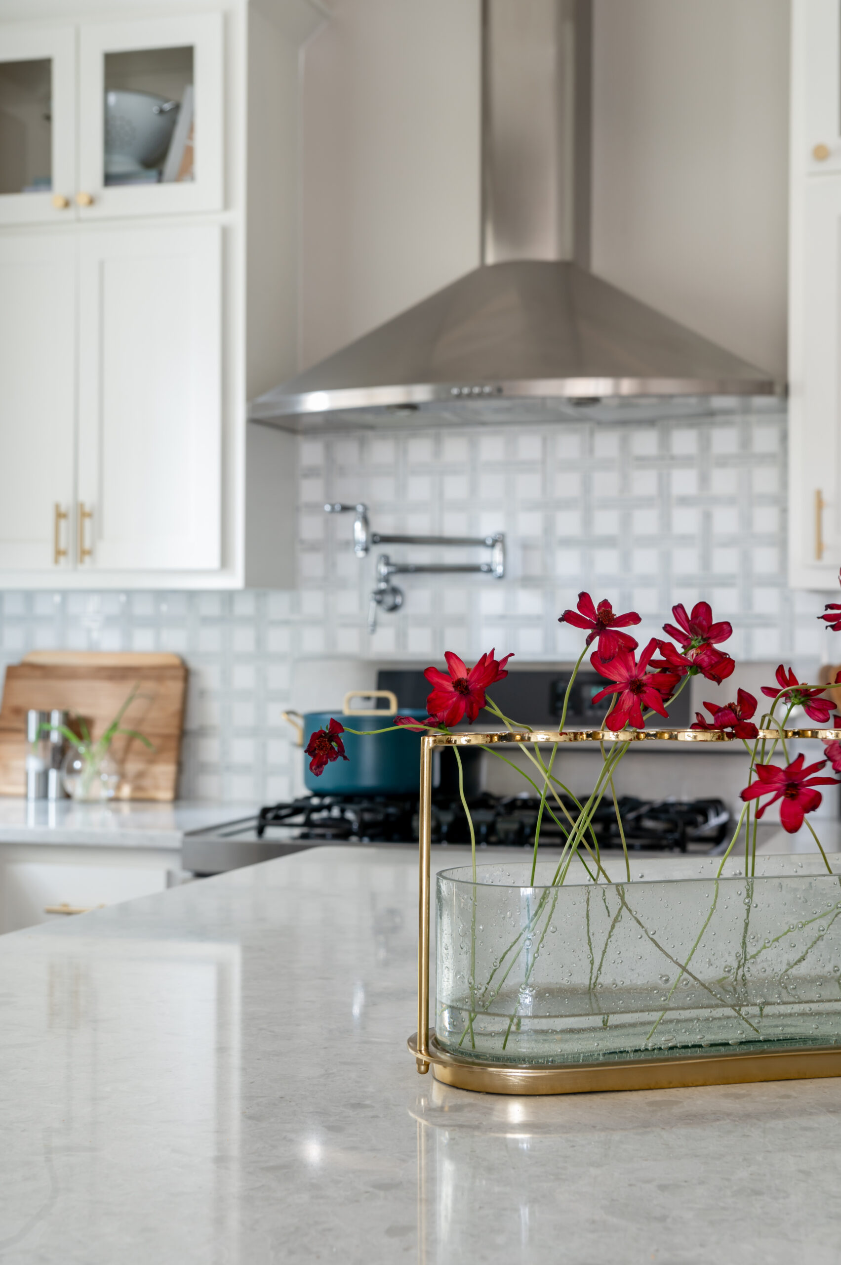 Luxury marble kitchen island and small red flowers