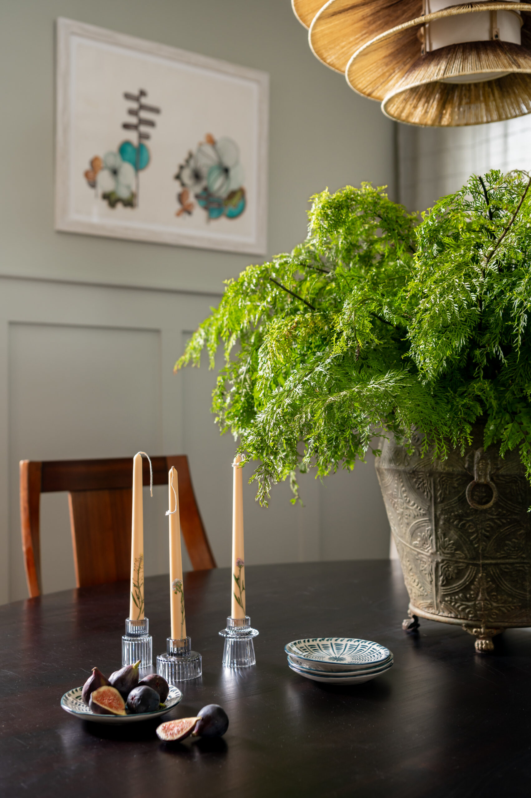 Dining room interior design with black wooden dining room table and luscious green plant