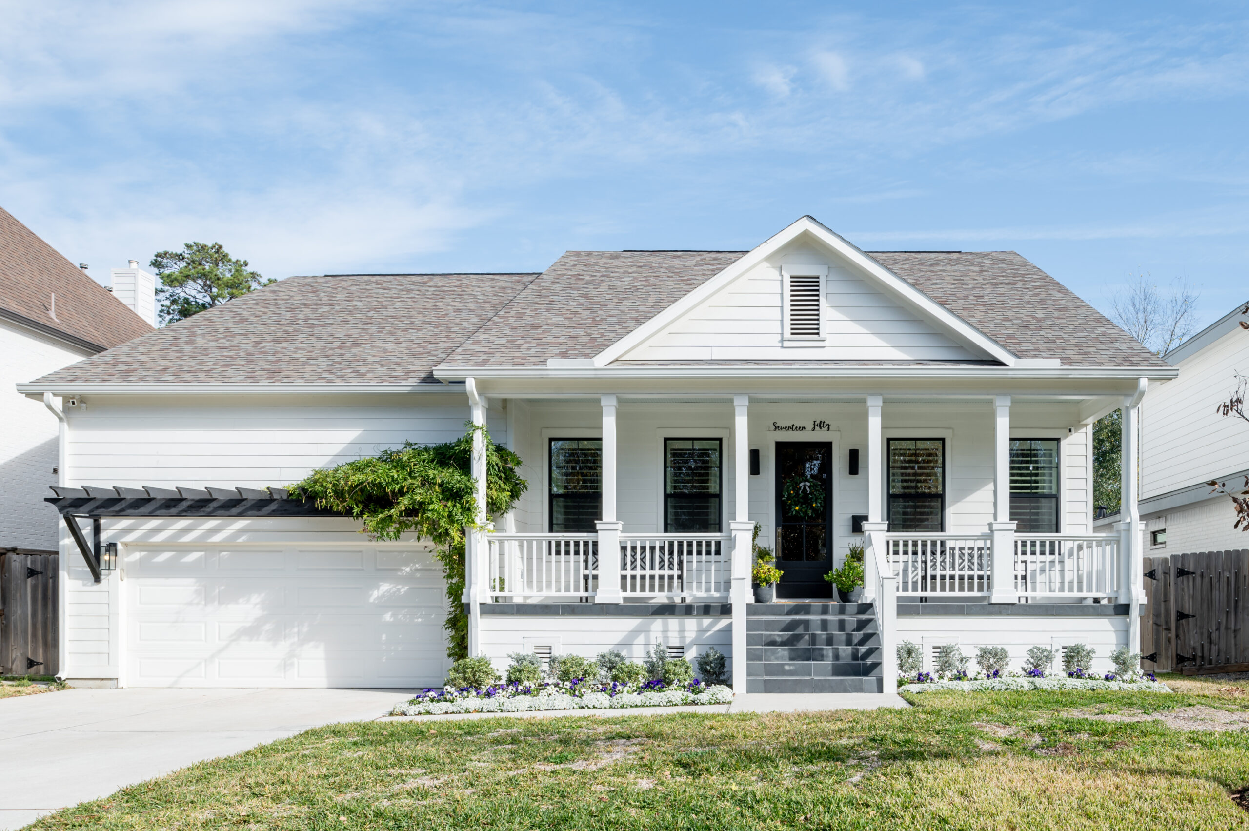 Exterior design of a white home with gray stone steps