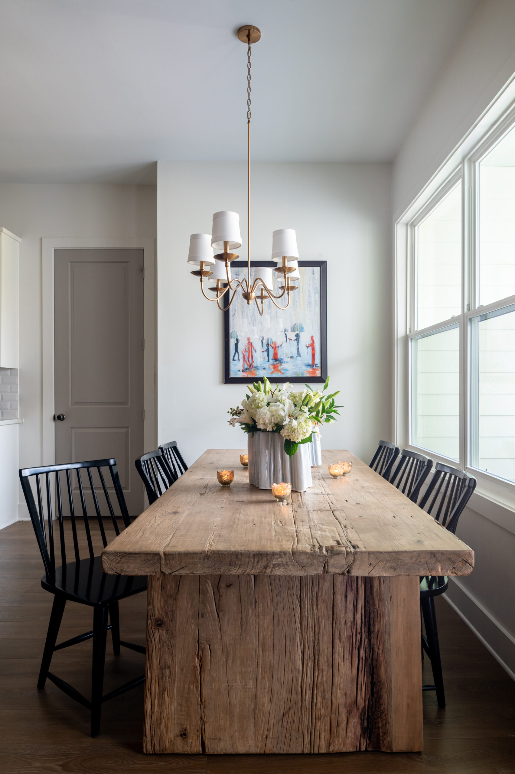 Dining room interior design with a wooden table and black chairs