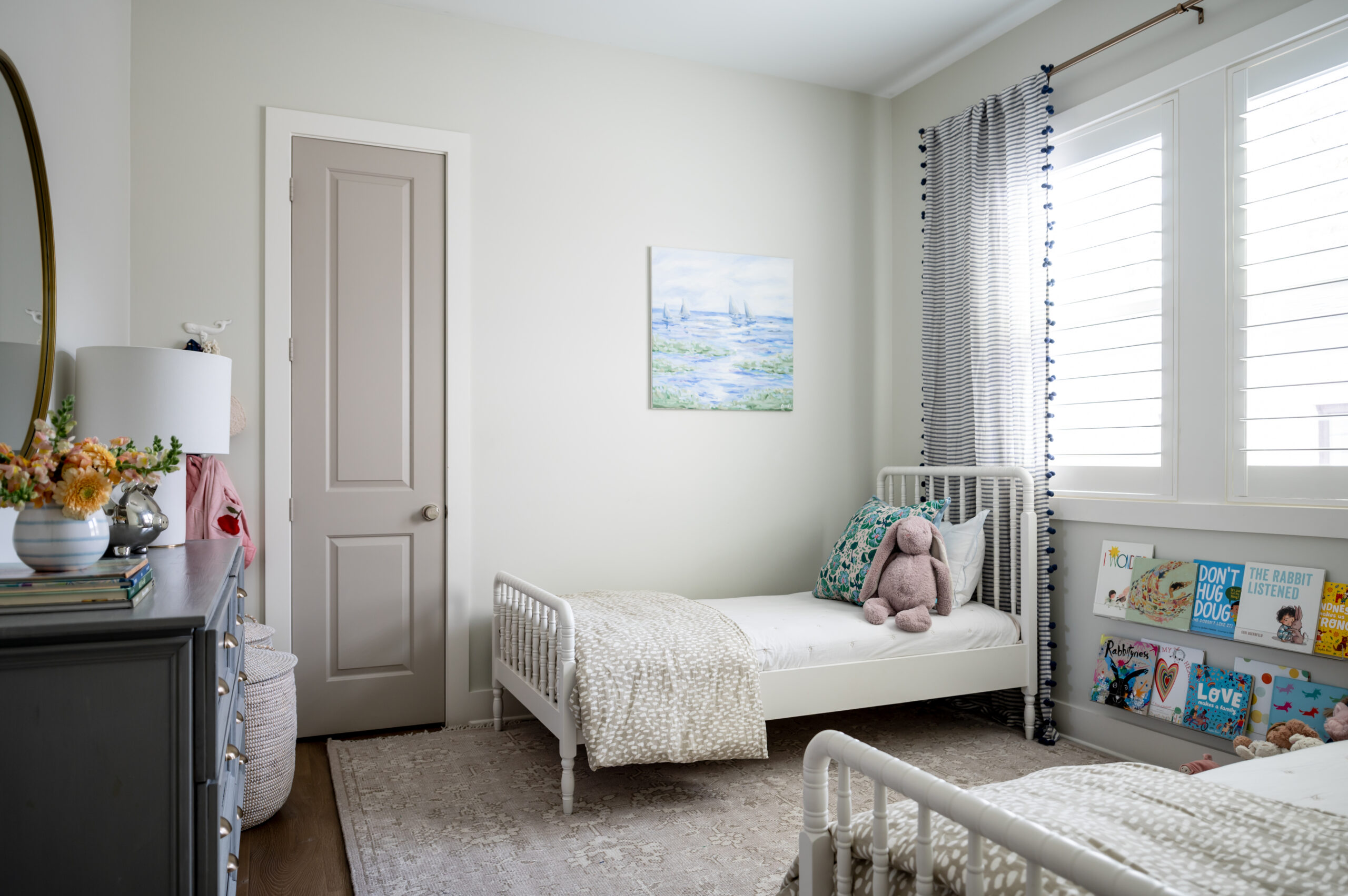 Beautiful little girls bedroom interior with twin beds and colorful decor