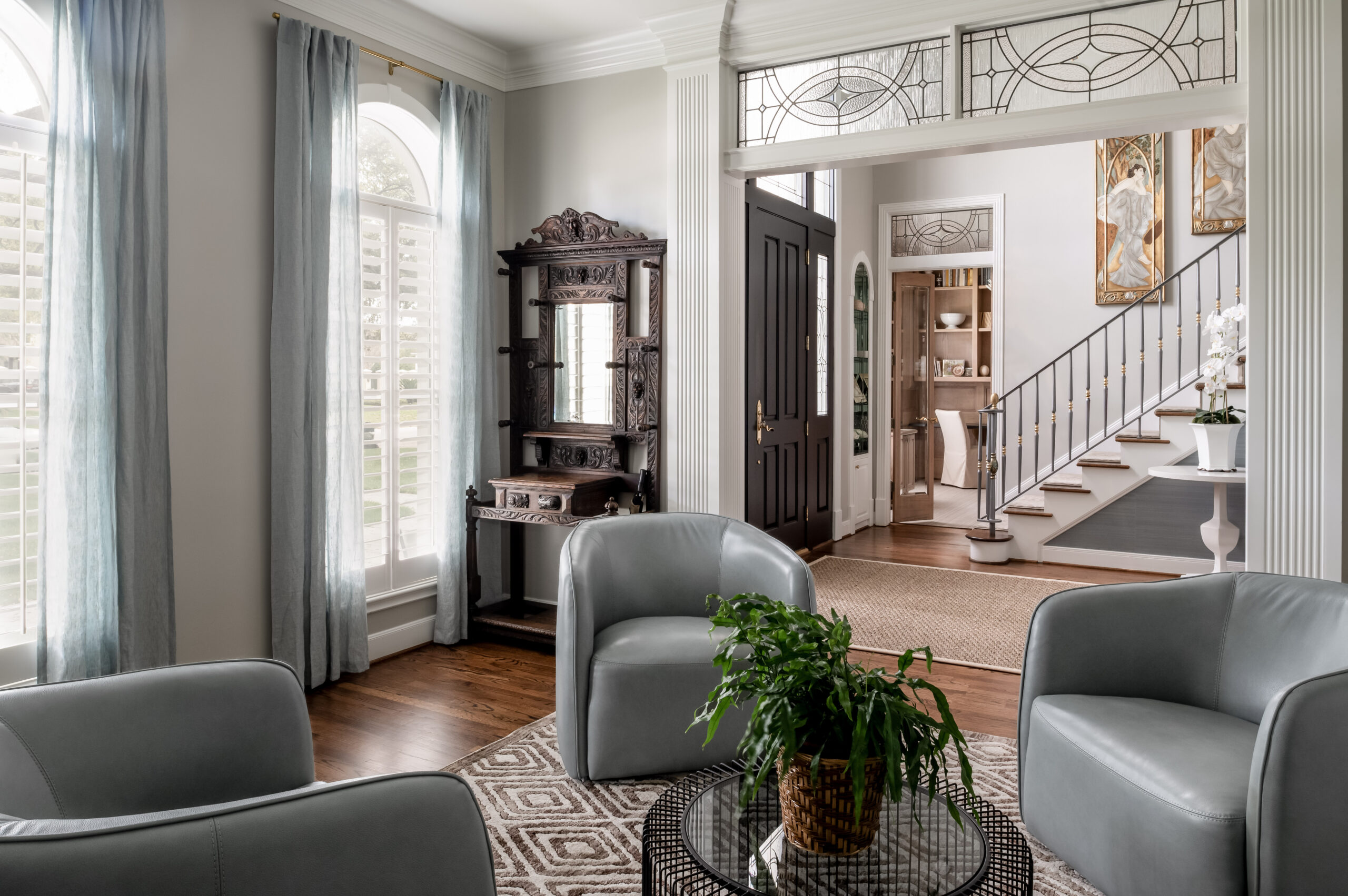 Beautiful living room interior design with grey seats and modern furniture and art