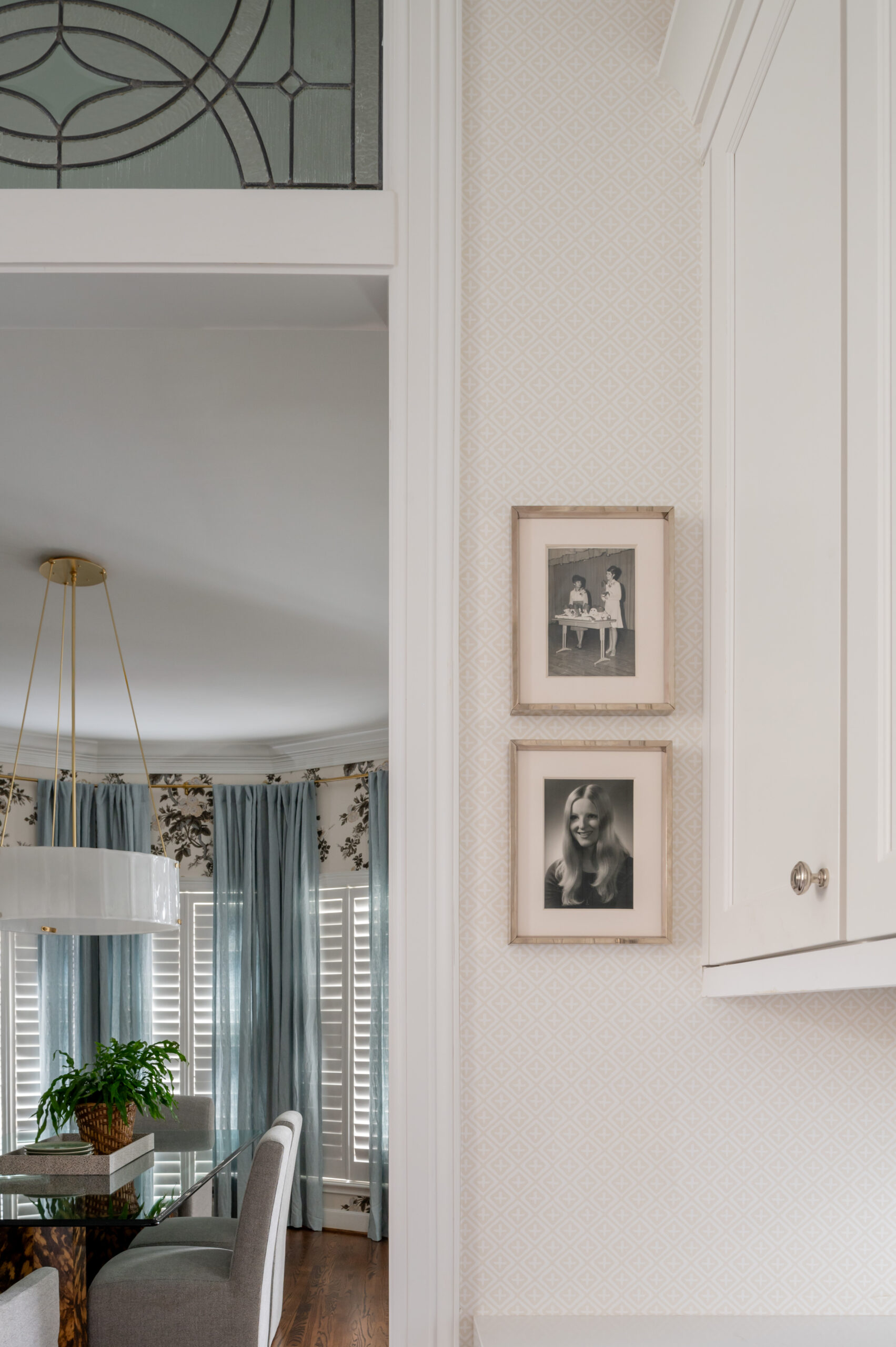 Kitchen design with family photos hanging on kitchen wall