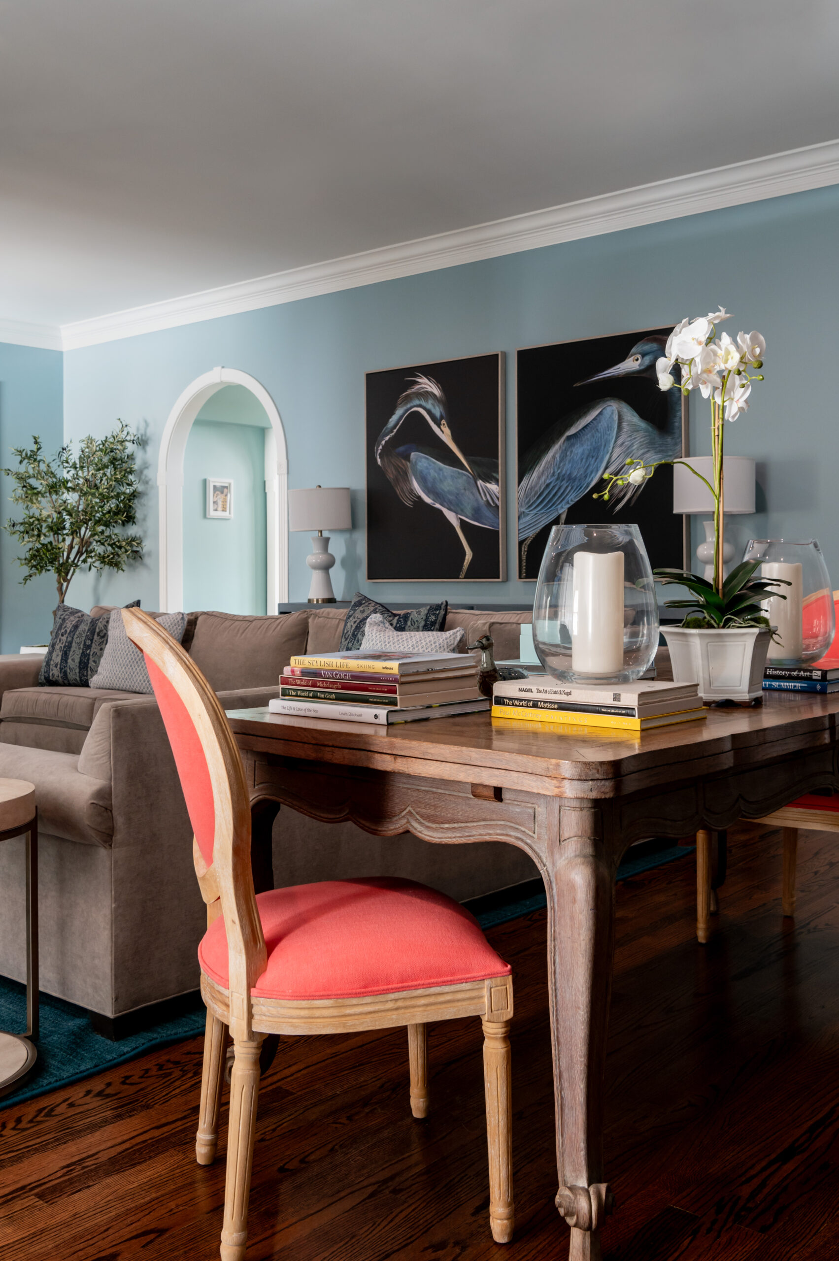 Living room interior design with wood side table and colorful chairs