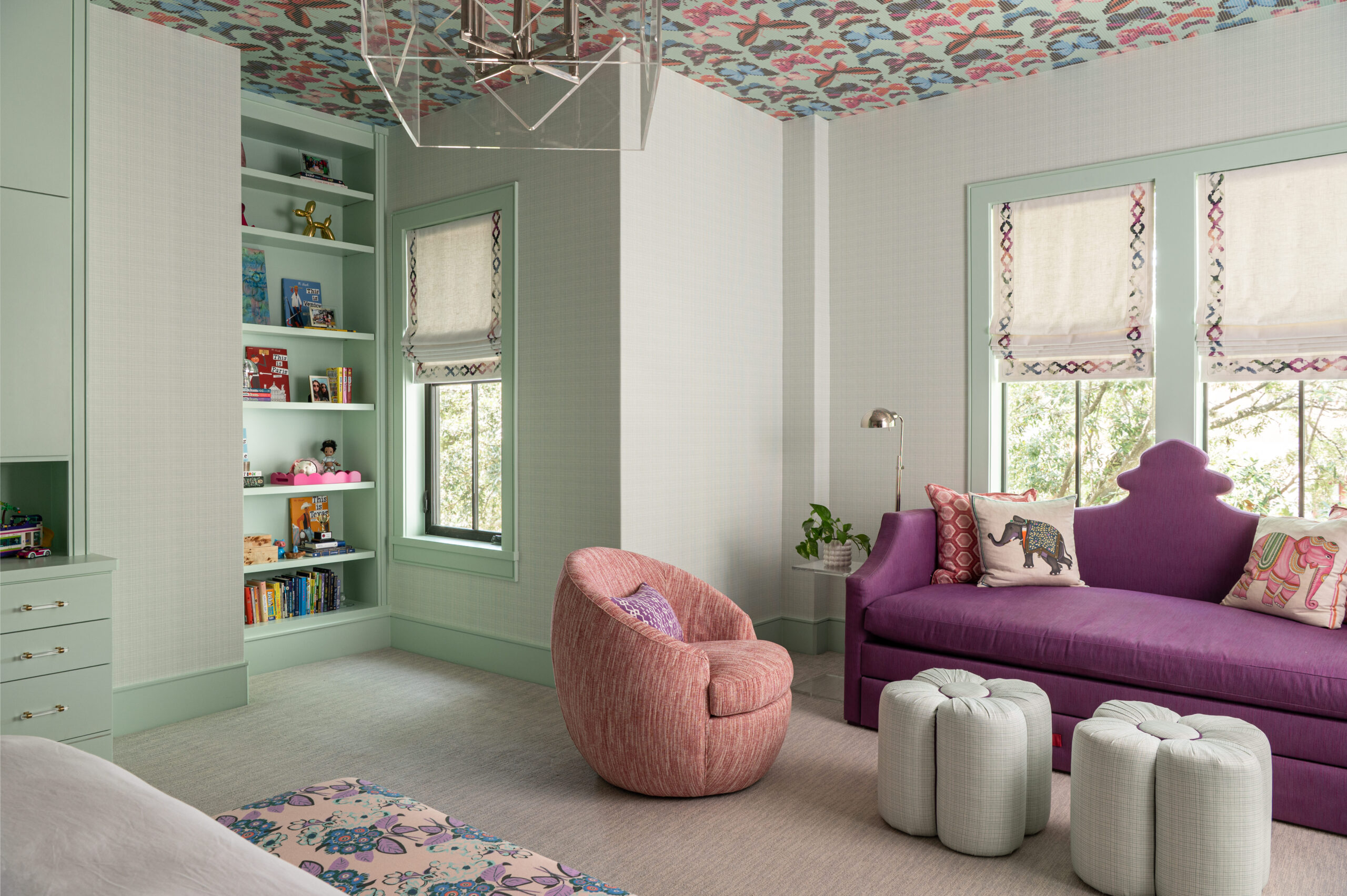 Tween Bedroom Interior Design with bright natural light, mint trim, colorful wallpapered ceiling, and fun pastel furnishings.